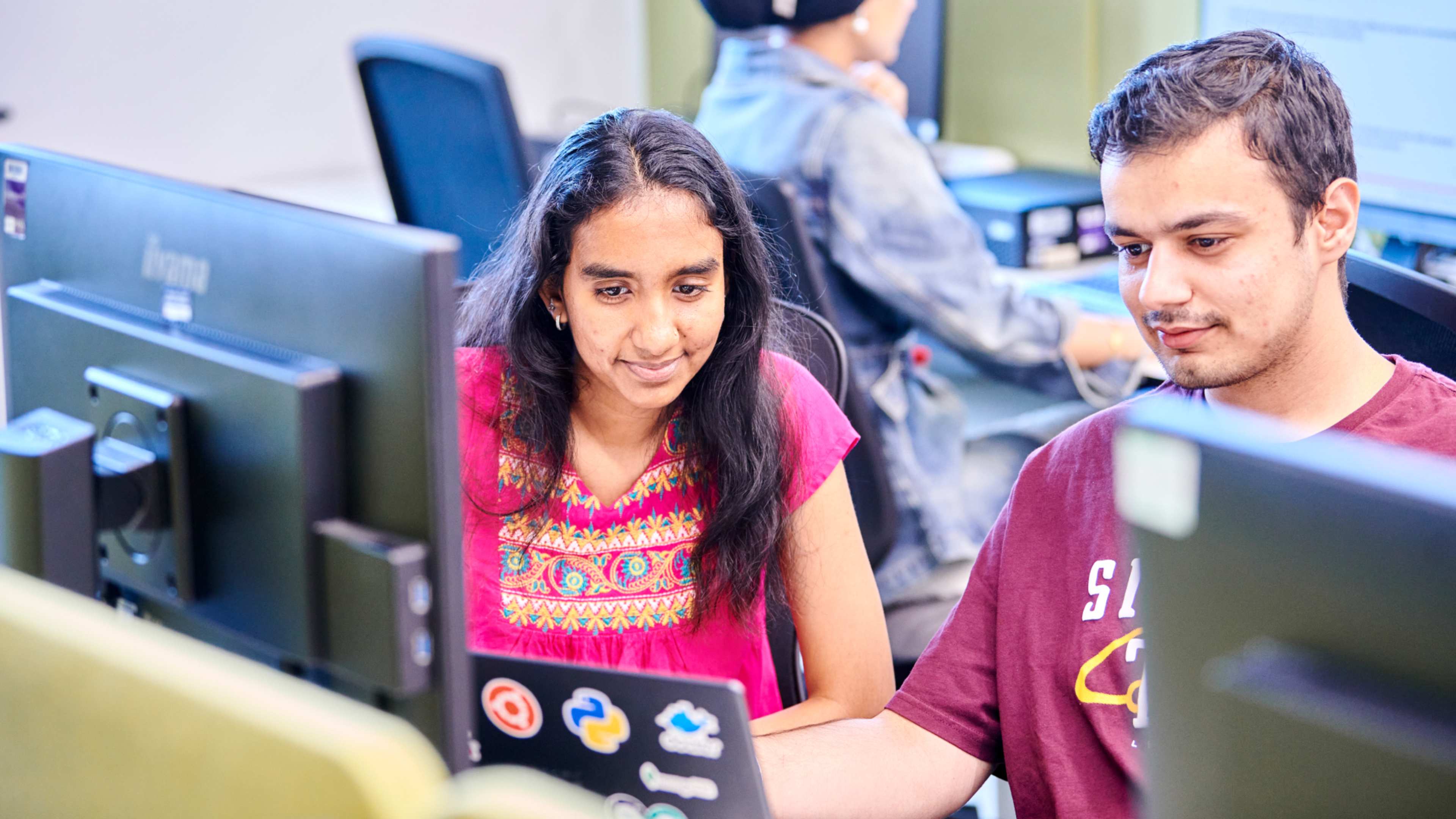 Computer science students collaborating in class