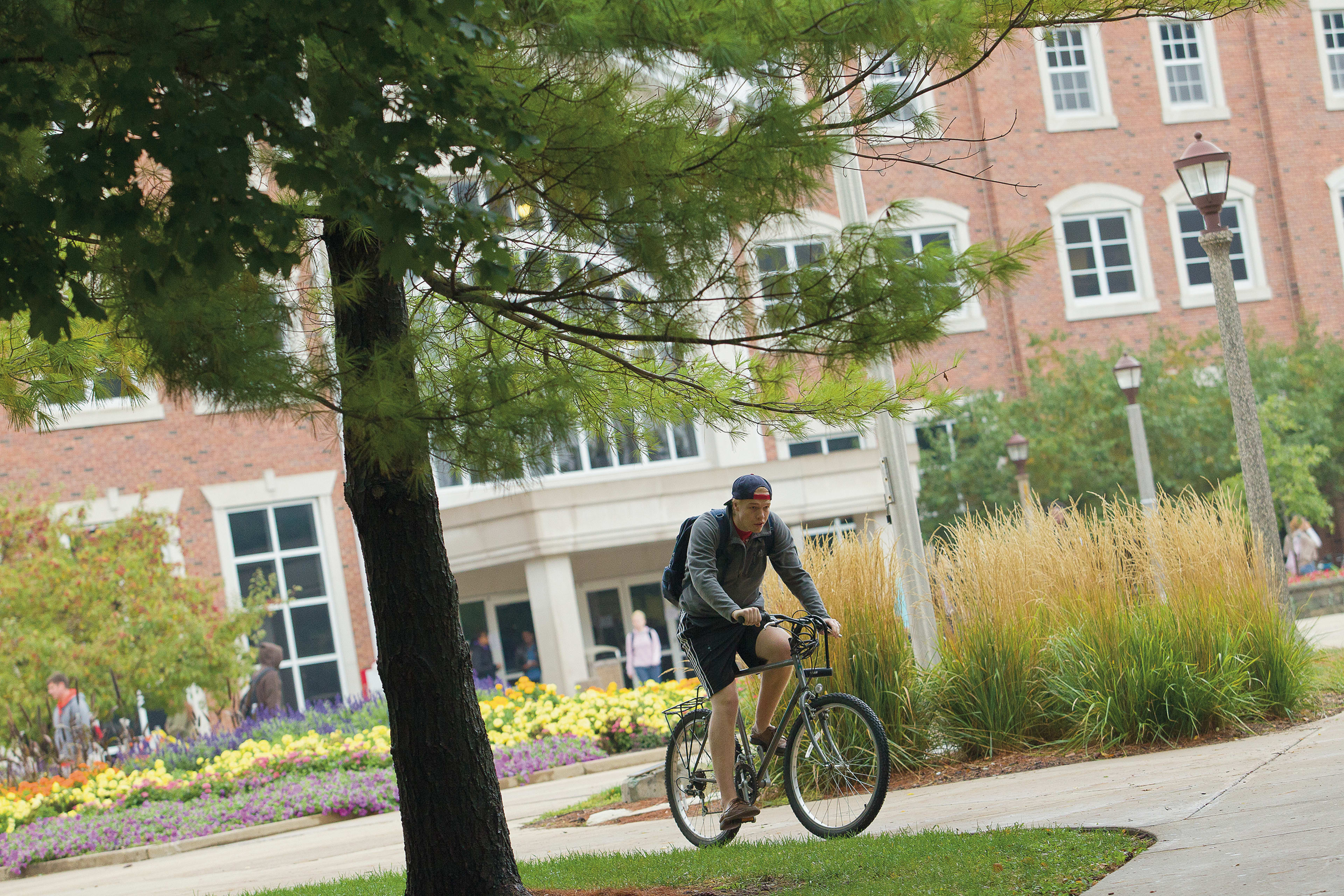 ISU male student on bicycle campus
