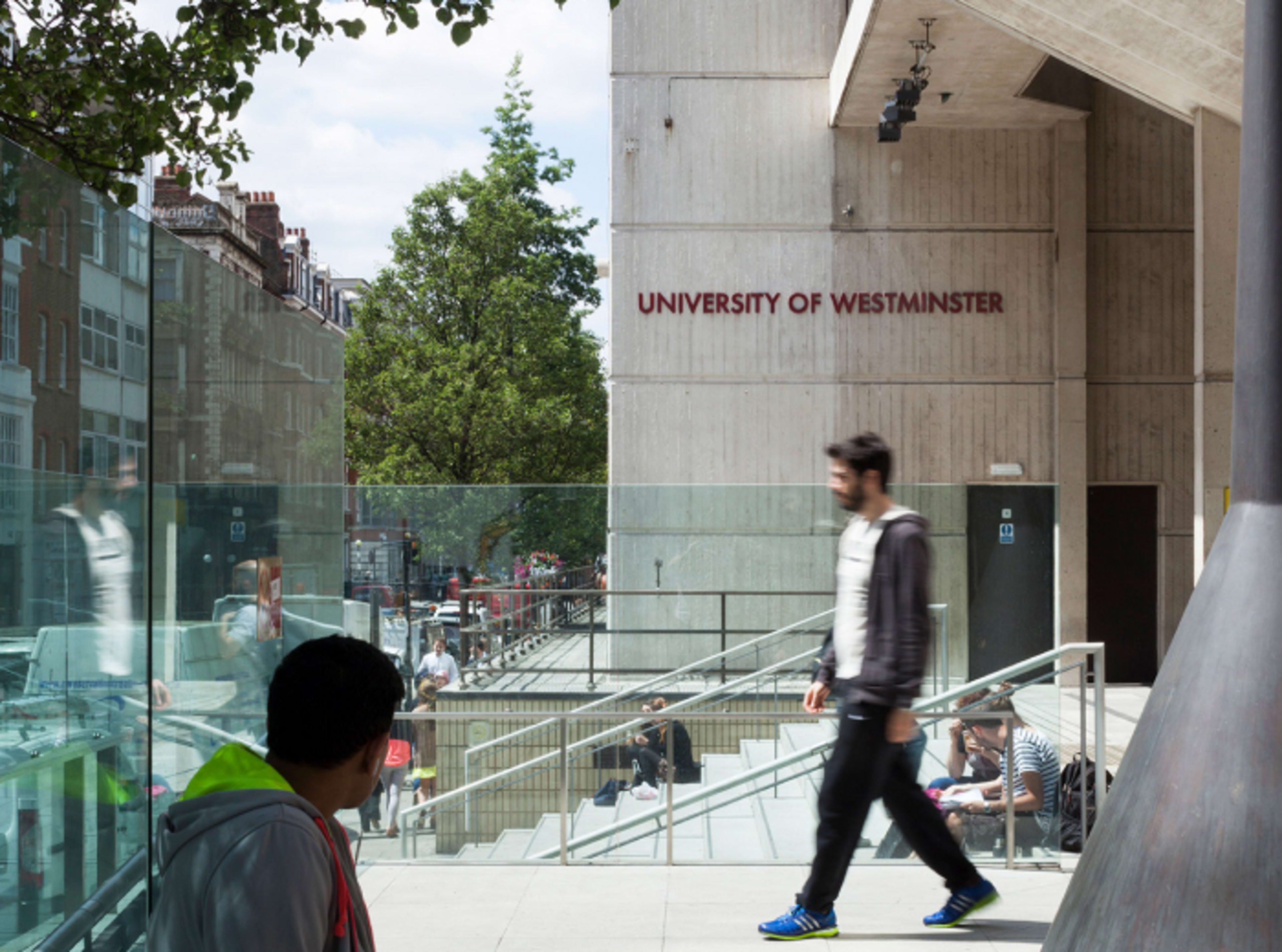 Exterior of the University of Westminster building with students walking past