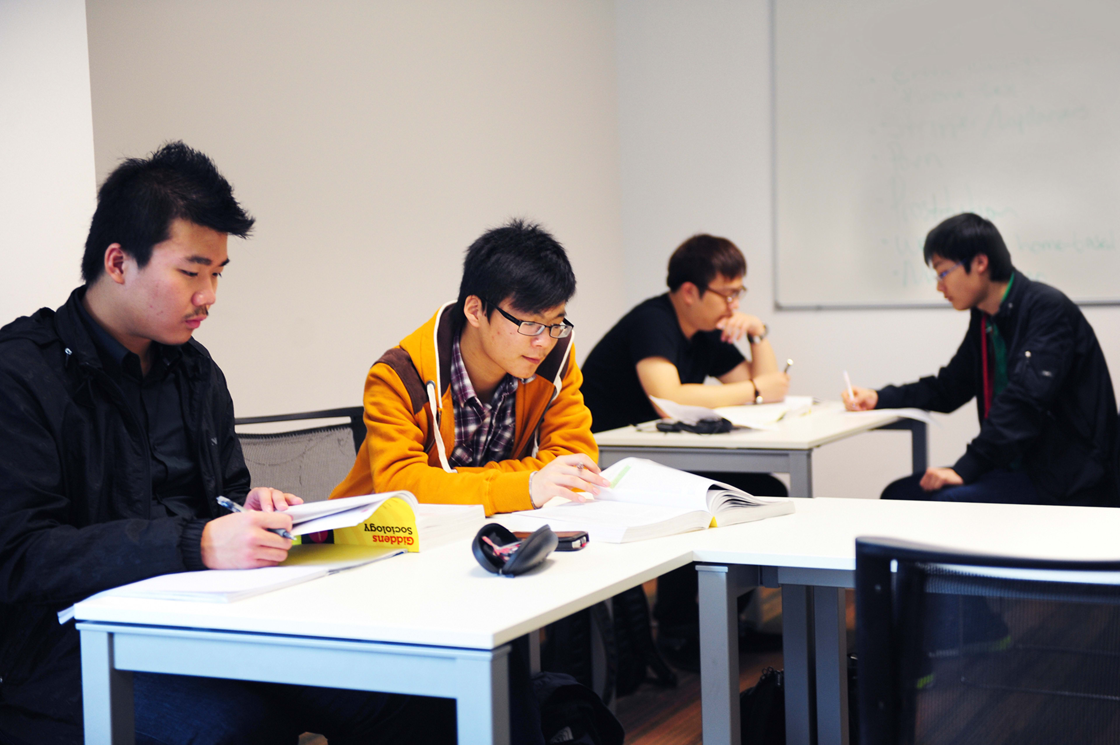 INTO international students study social sciences and media in a classroom