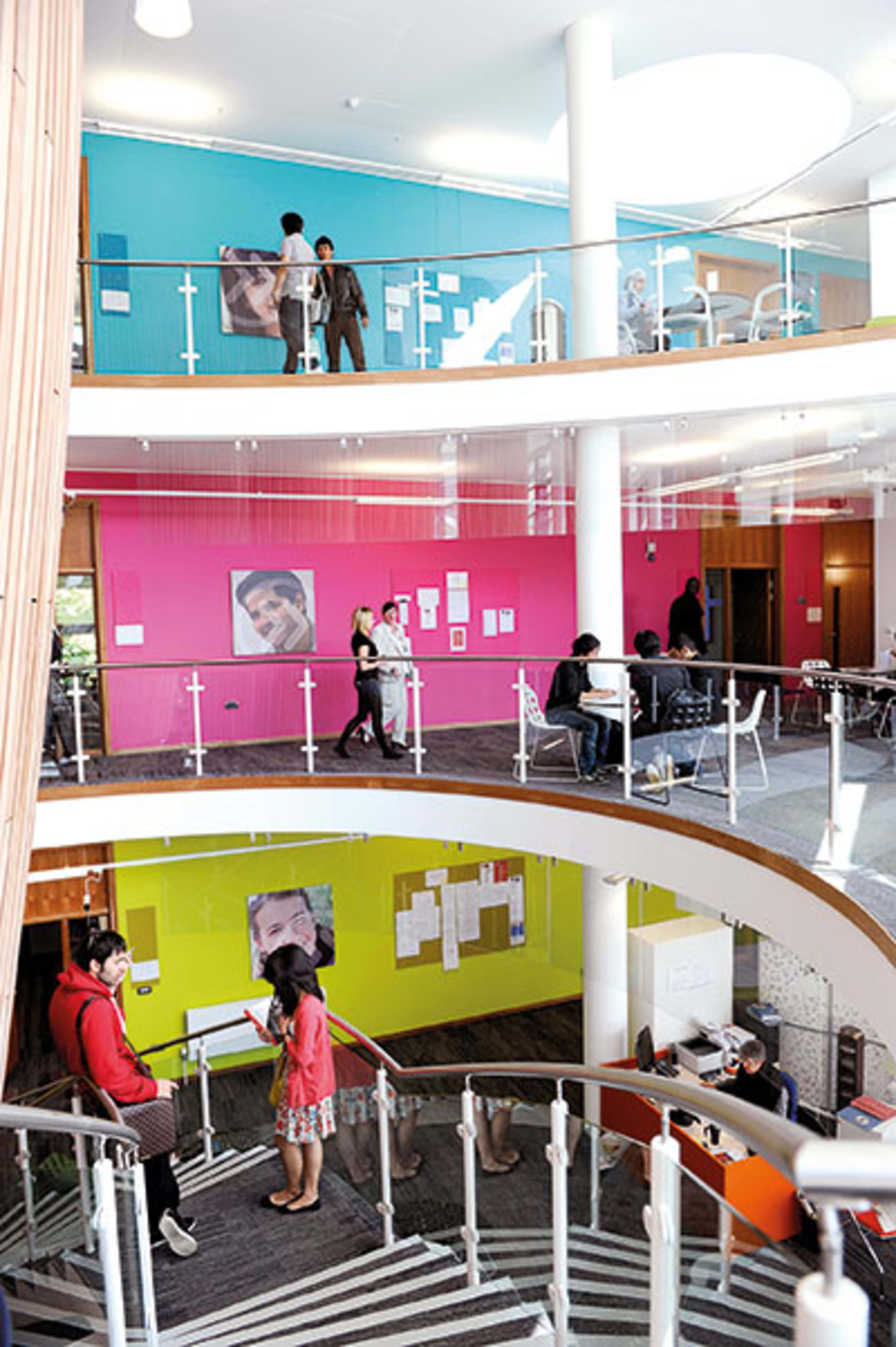 Inside INTO Centre with international students on staircase