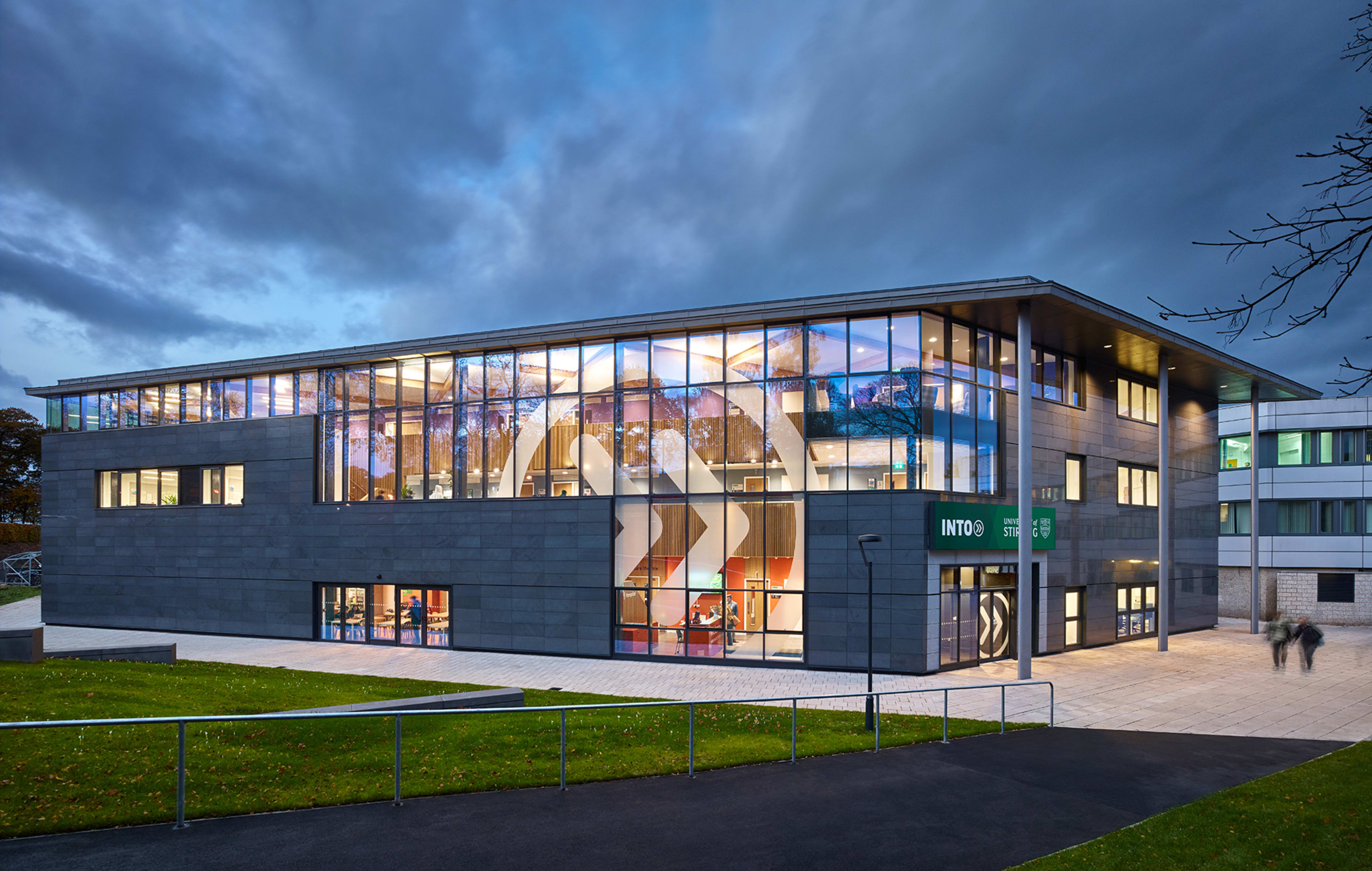 Exterior view in the evening of the INTO Centre at University of Stirling