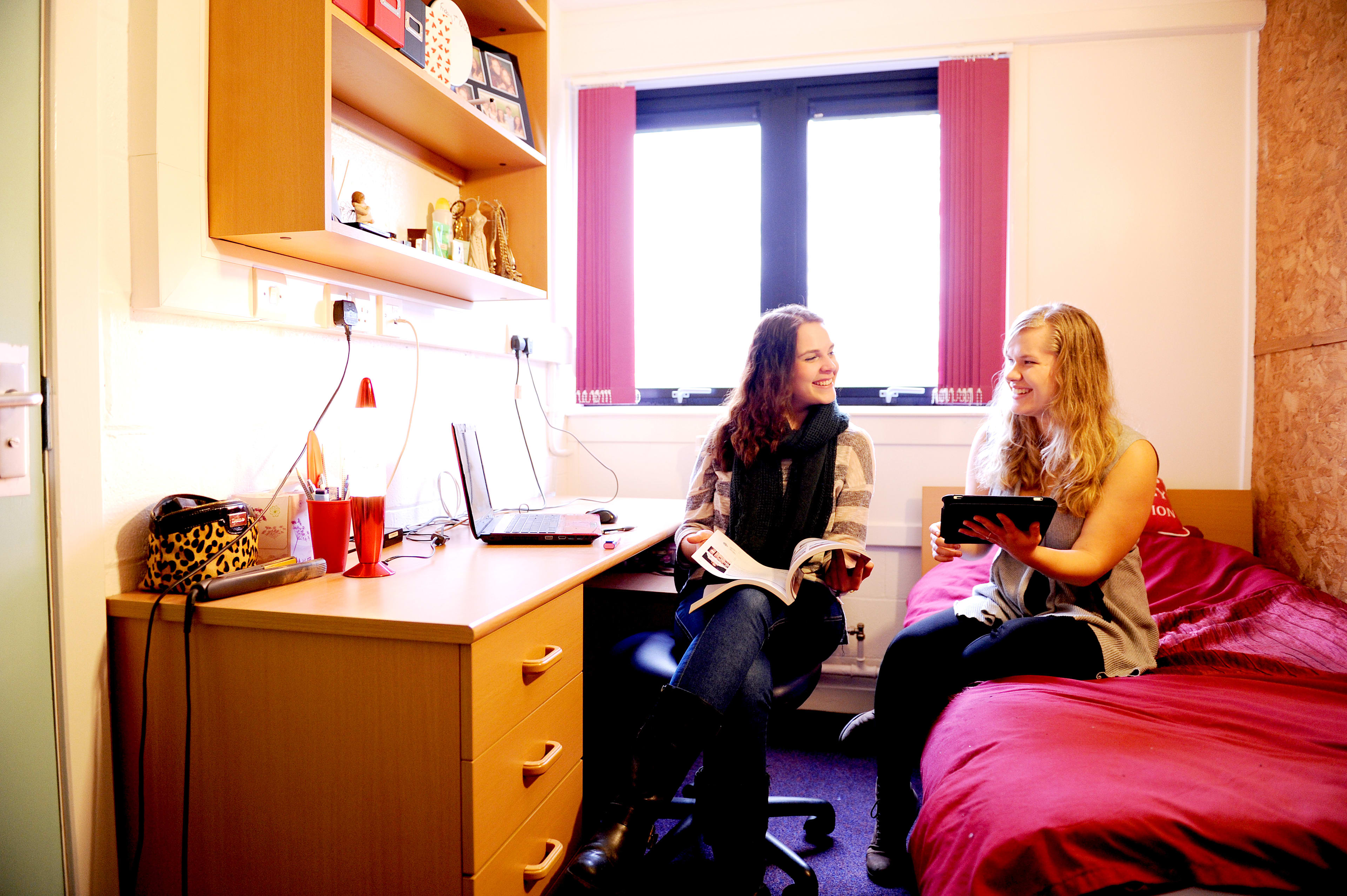 Students talking in a student bedroom at INTO Stirling John Forty's Court