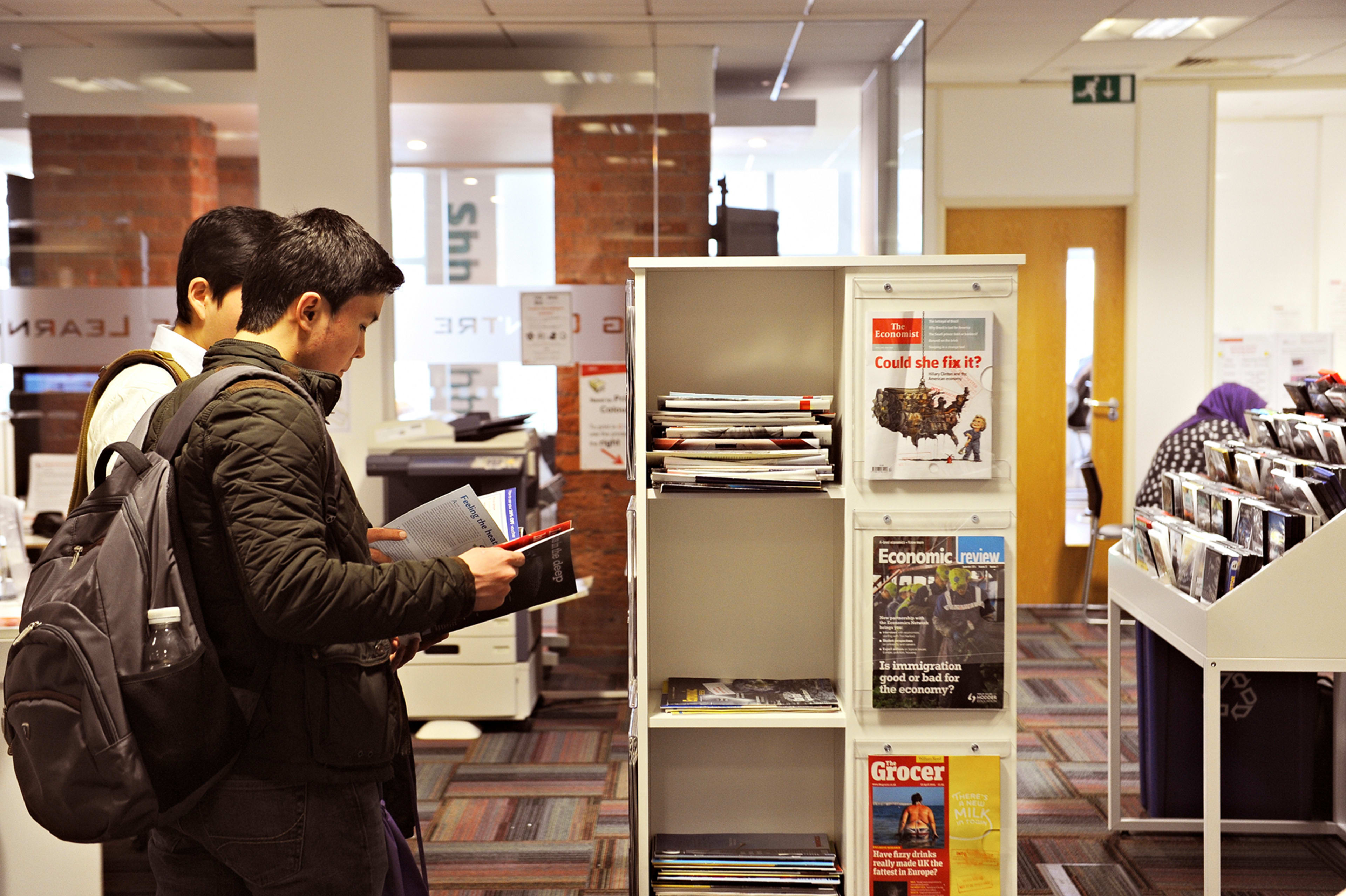 International students looking at resources in the Learning Resource Center