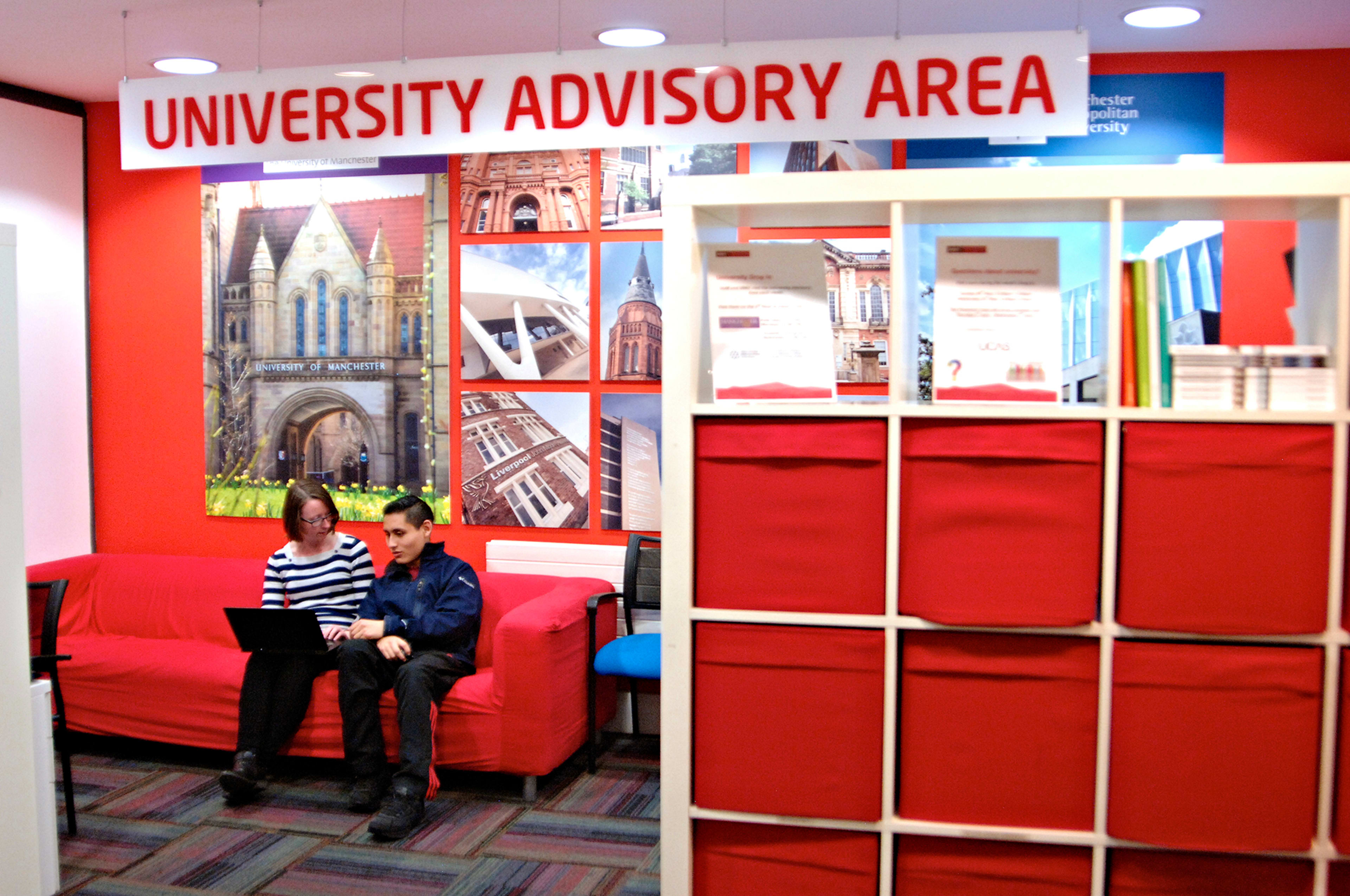 University advisory area in centre with staff helping international student