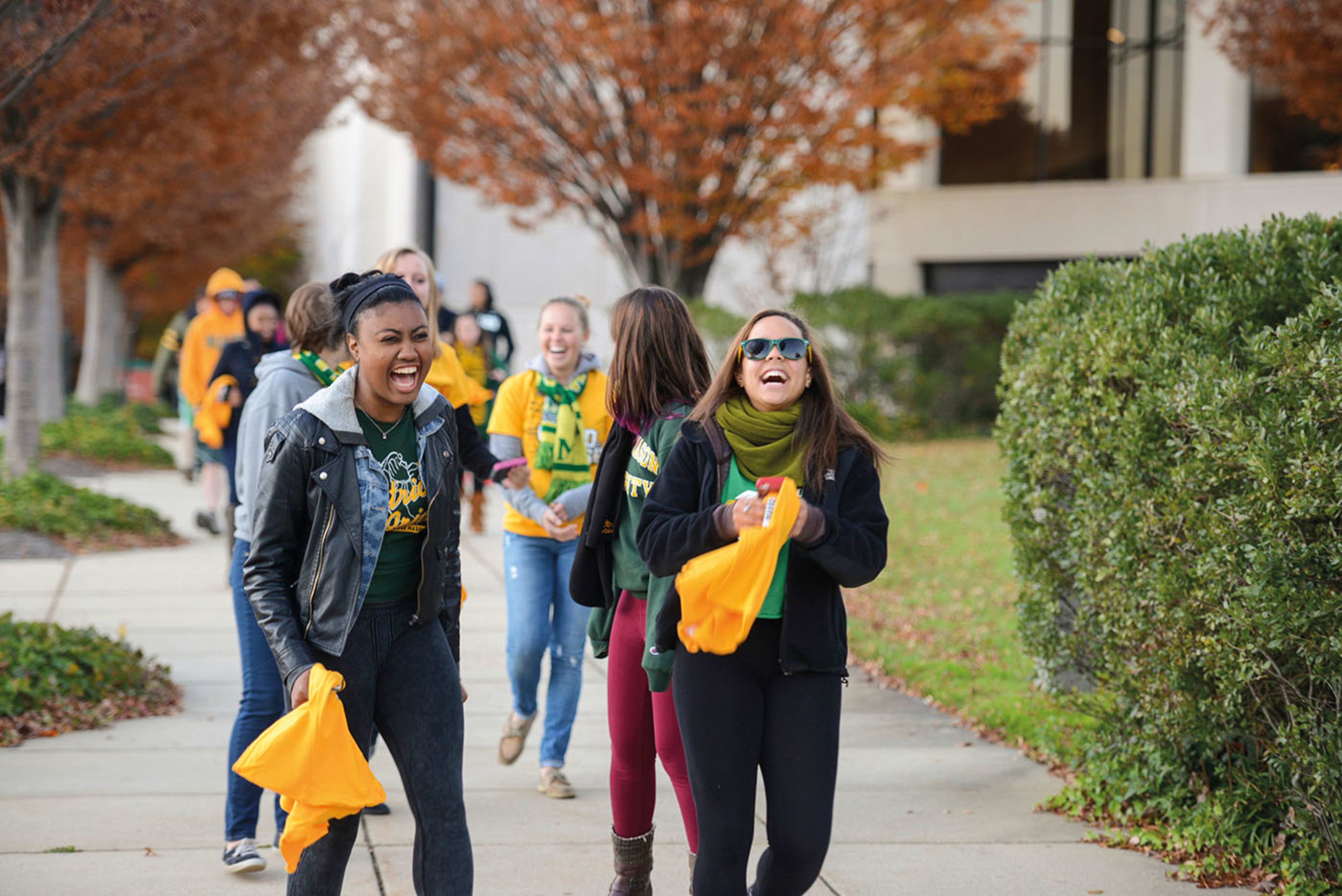 Mason students gather outside of their residence hall