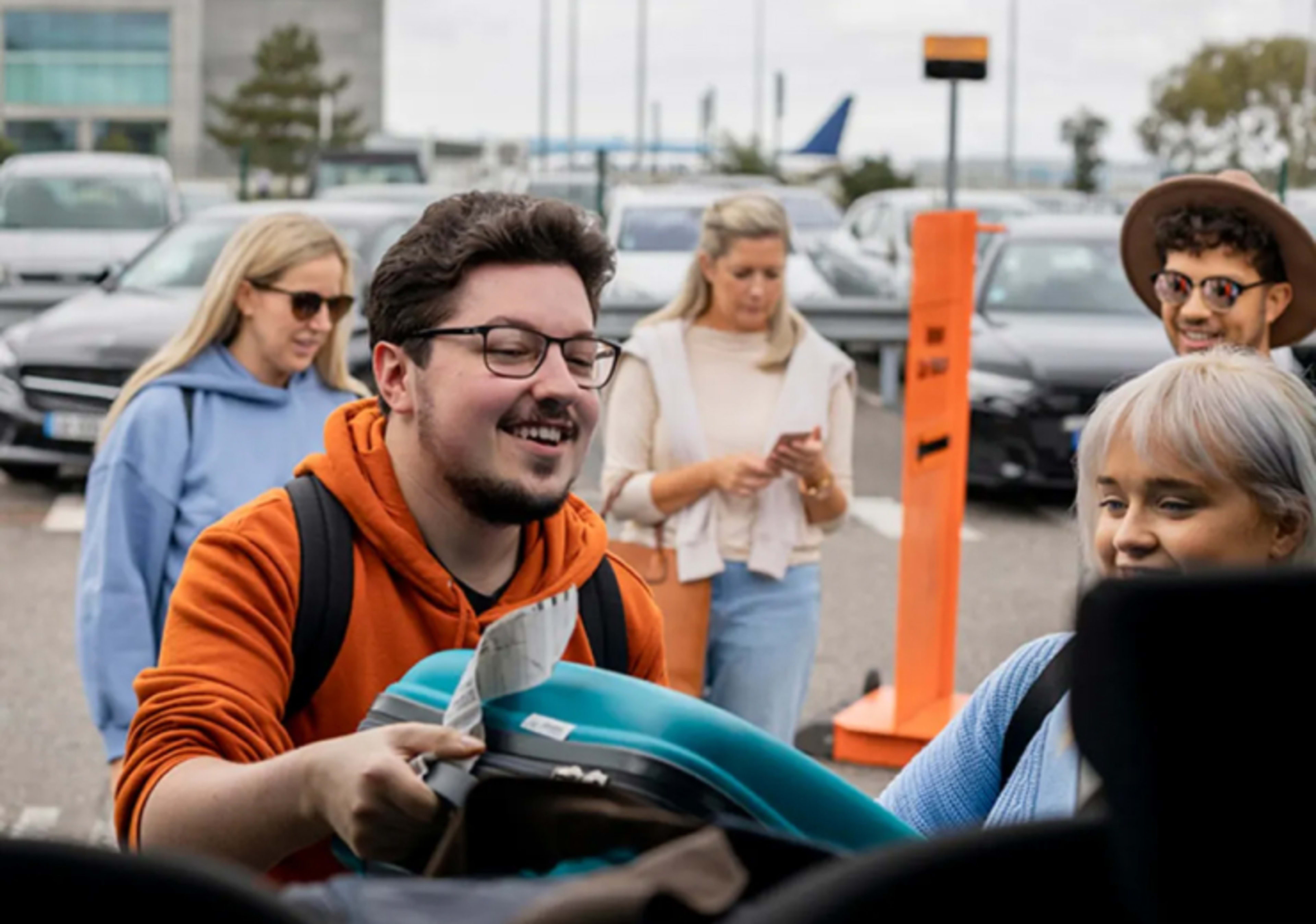 Loading luggage in airport taxi