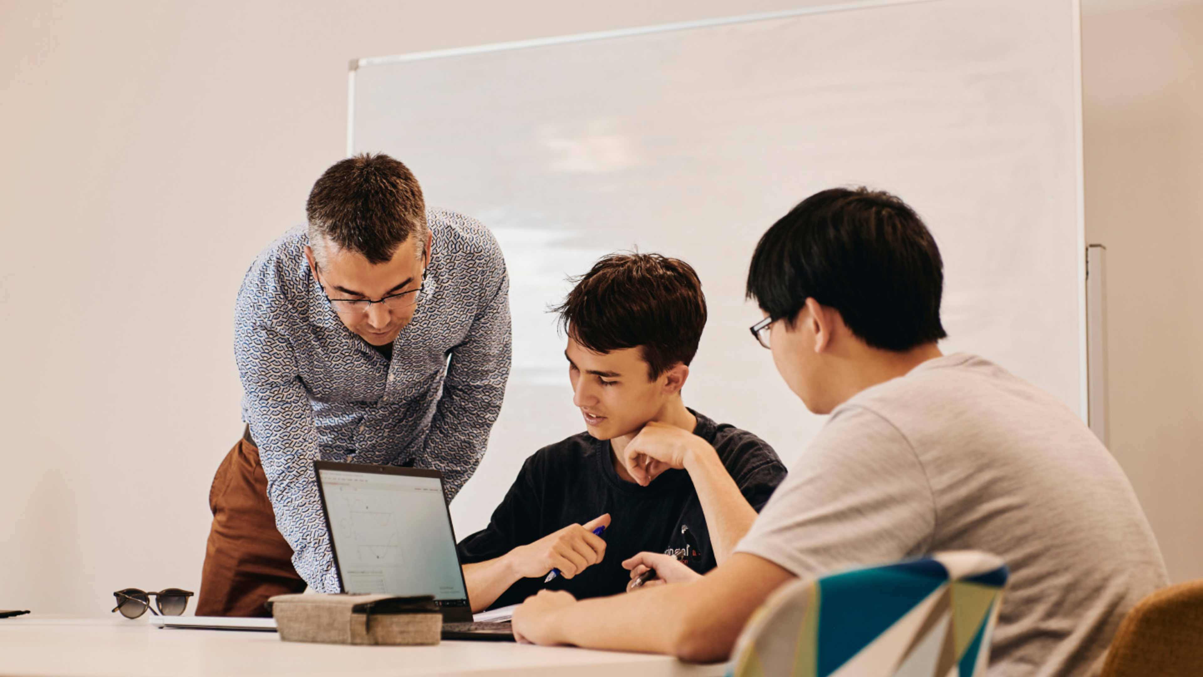 Students with teacher in classroom
