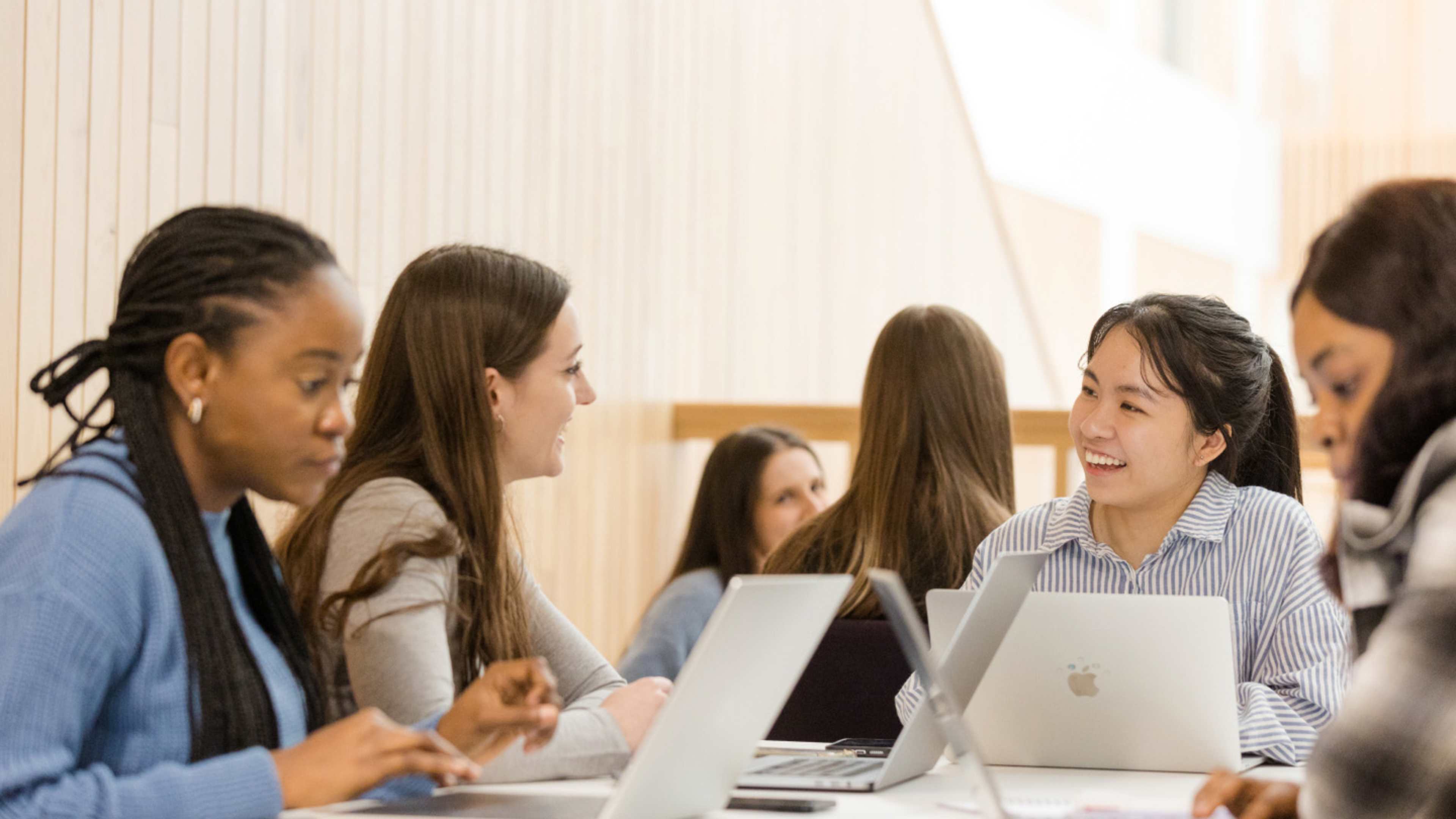 Image of students working on laptops