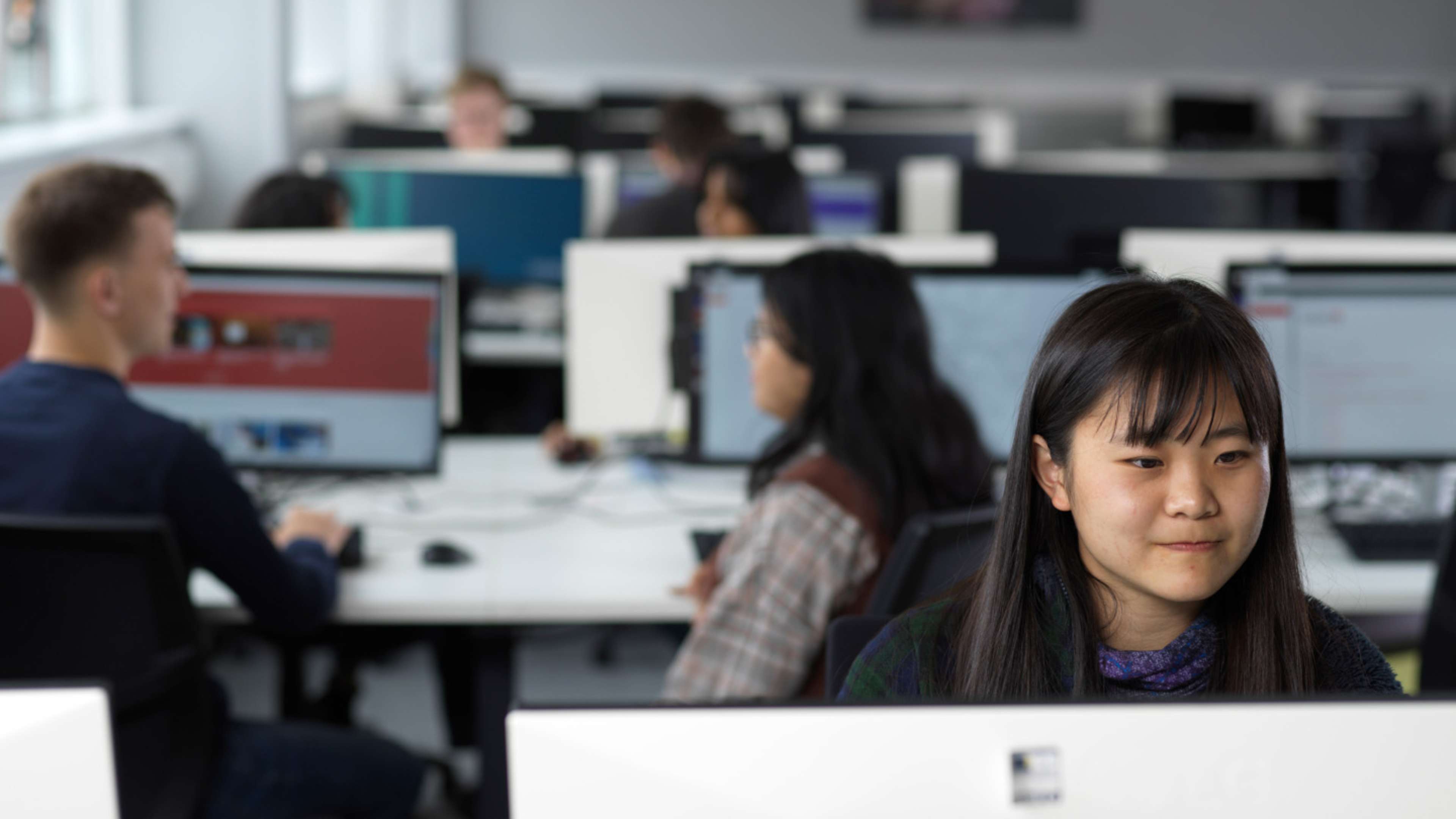 Student at computer in computer suite