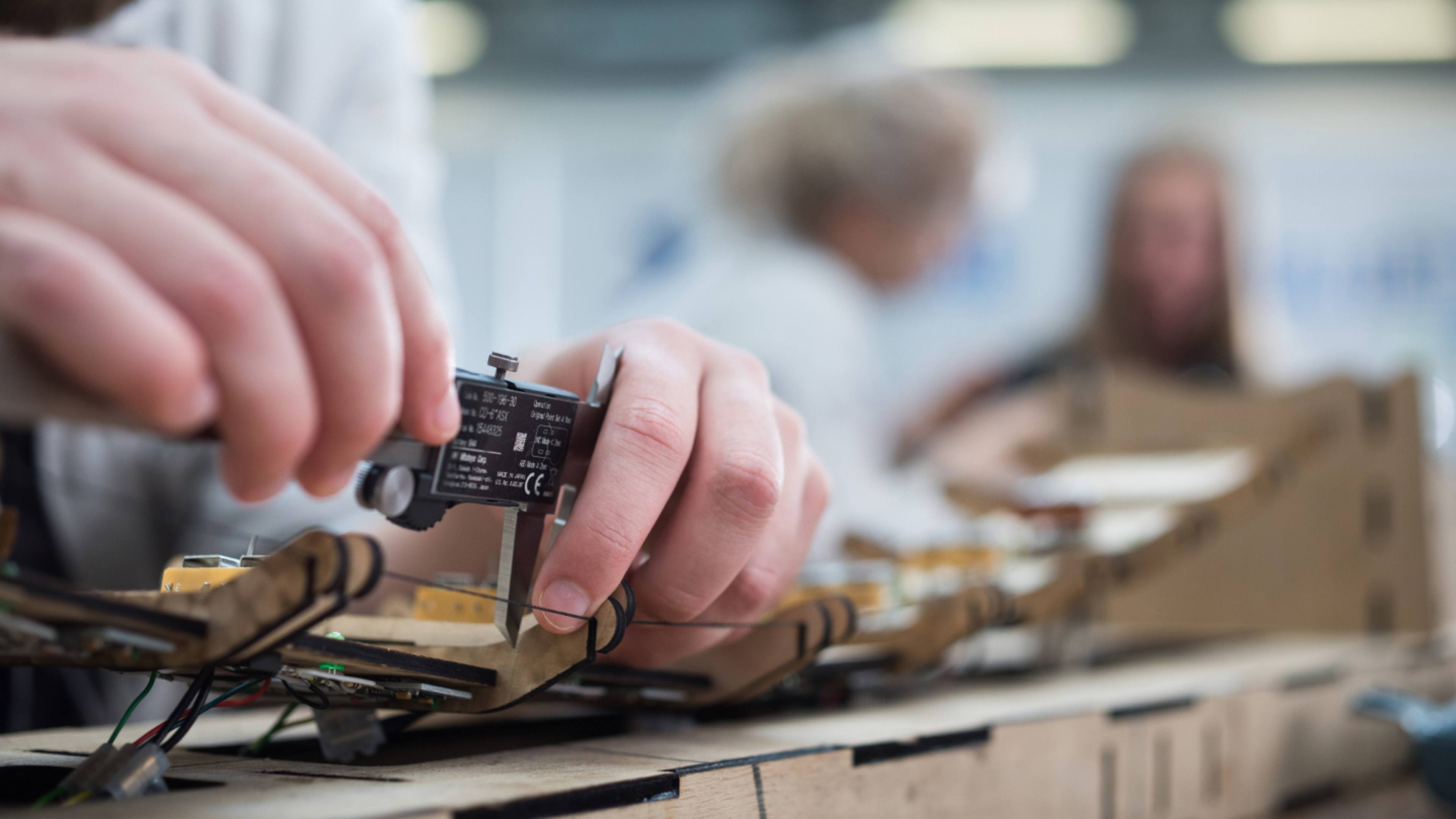 Close up image of student working on engineering project