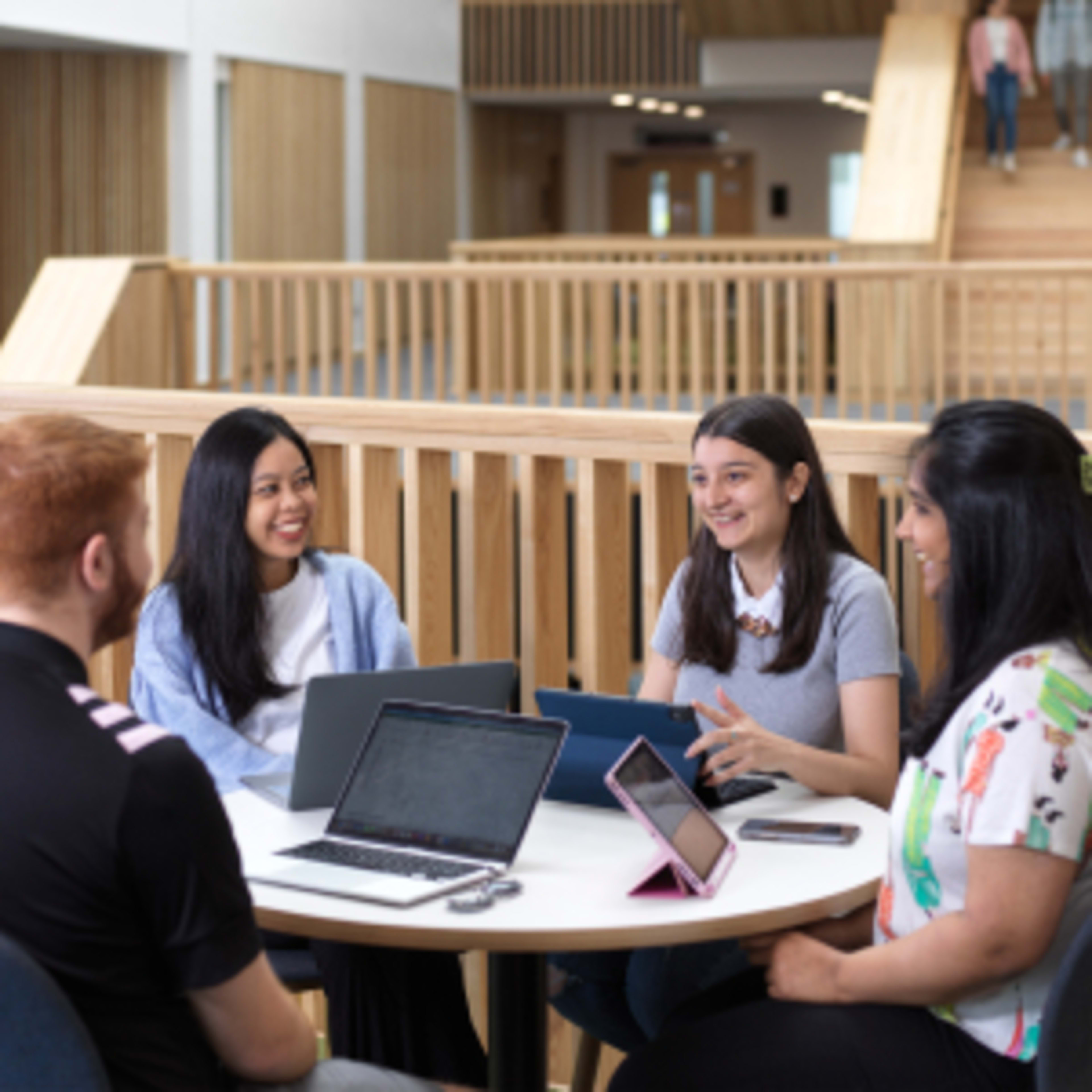 Image of students at Lancaster University Management School sitting at laptops