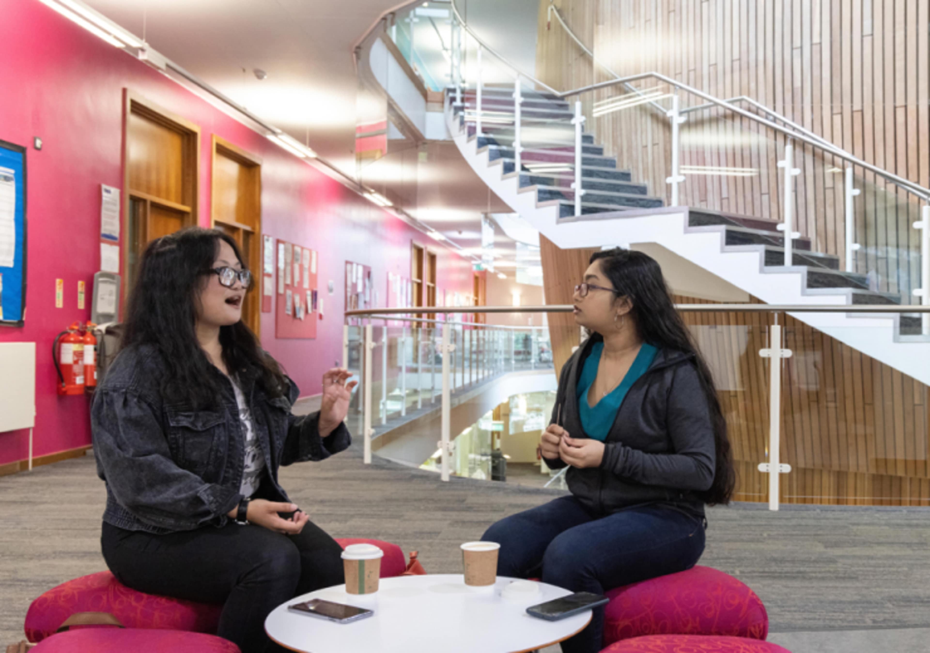 two young women talking 