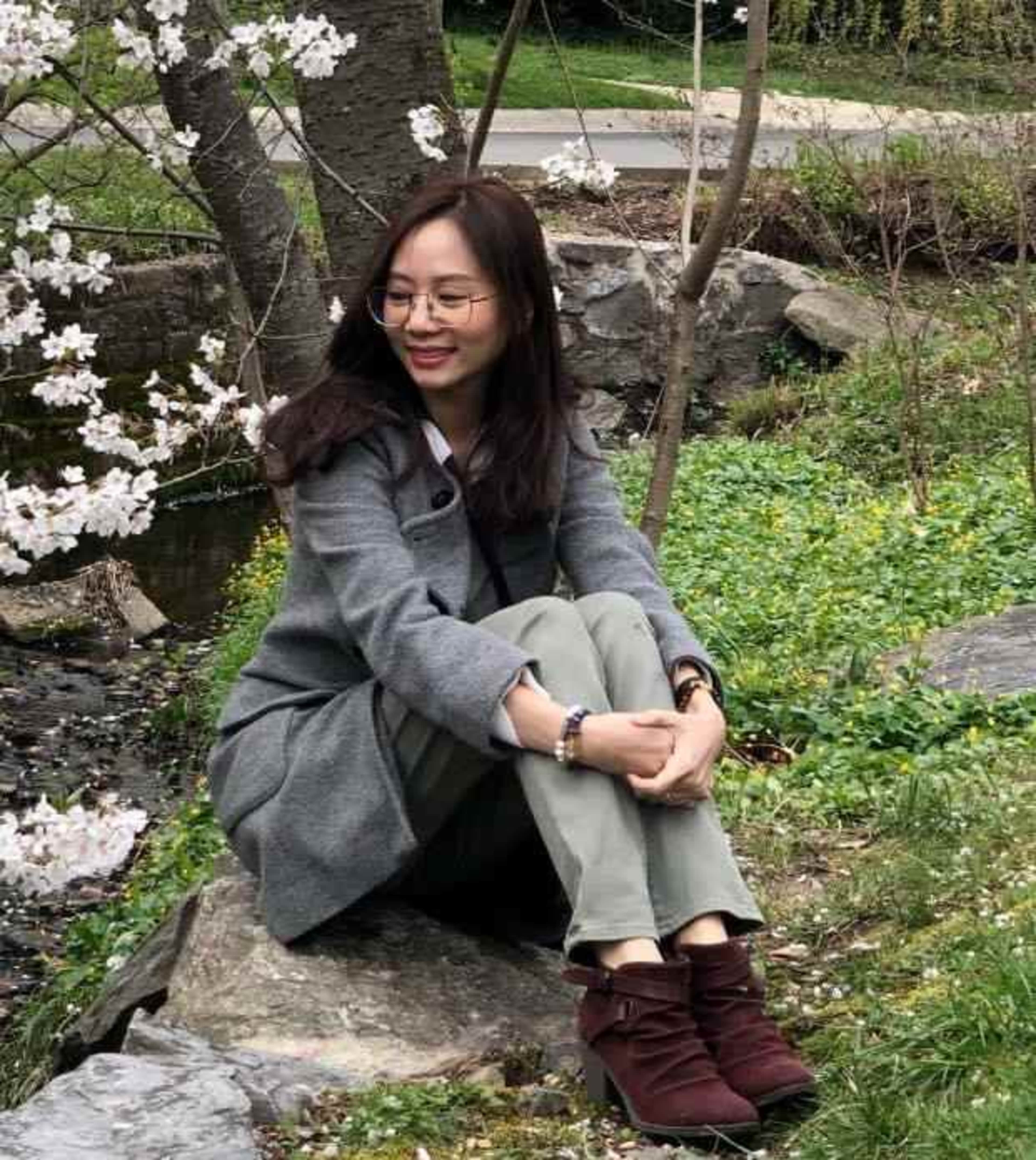 Student on a rock while smiling