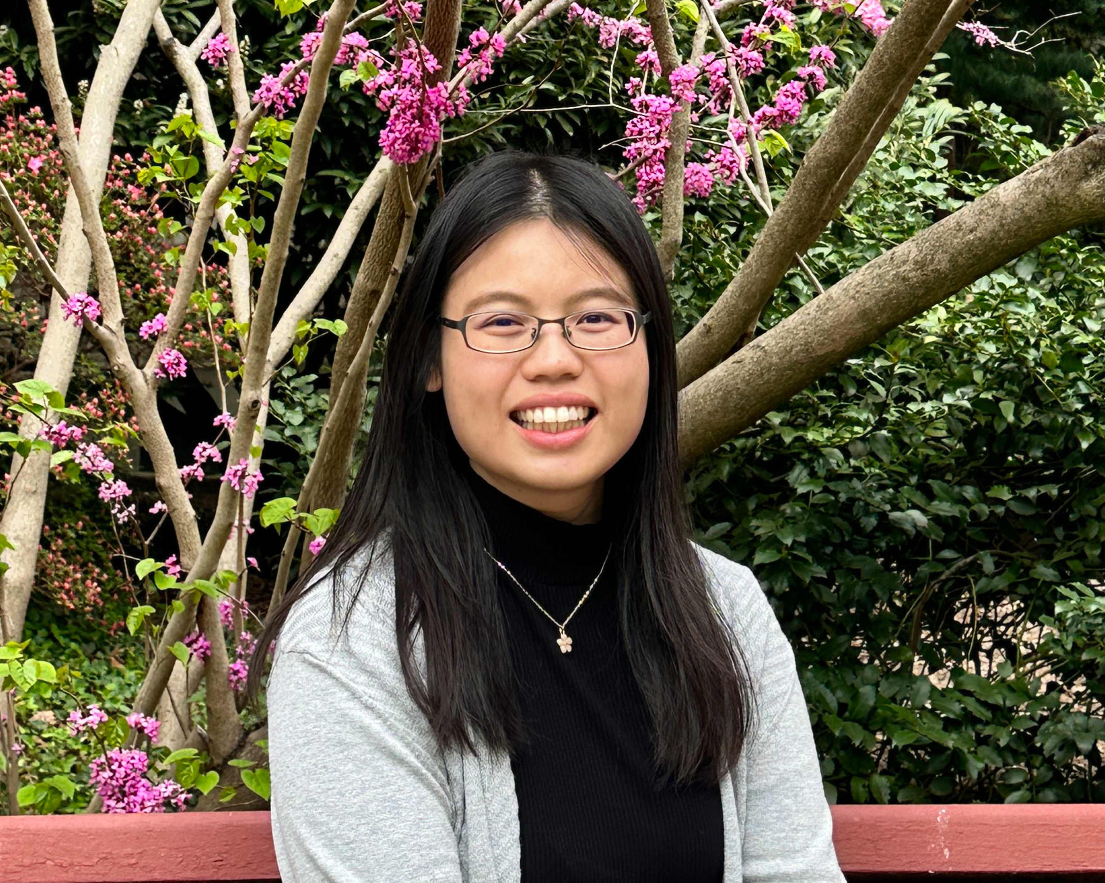 Smiling Student with flower for background