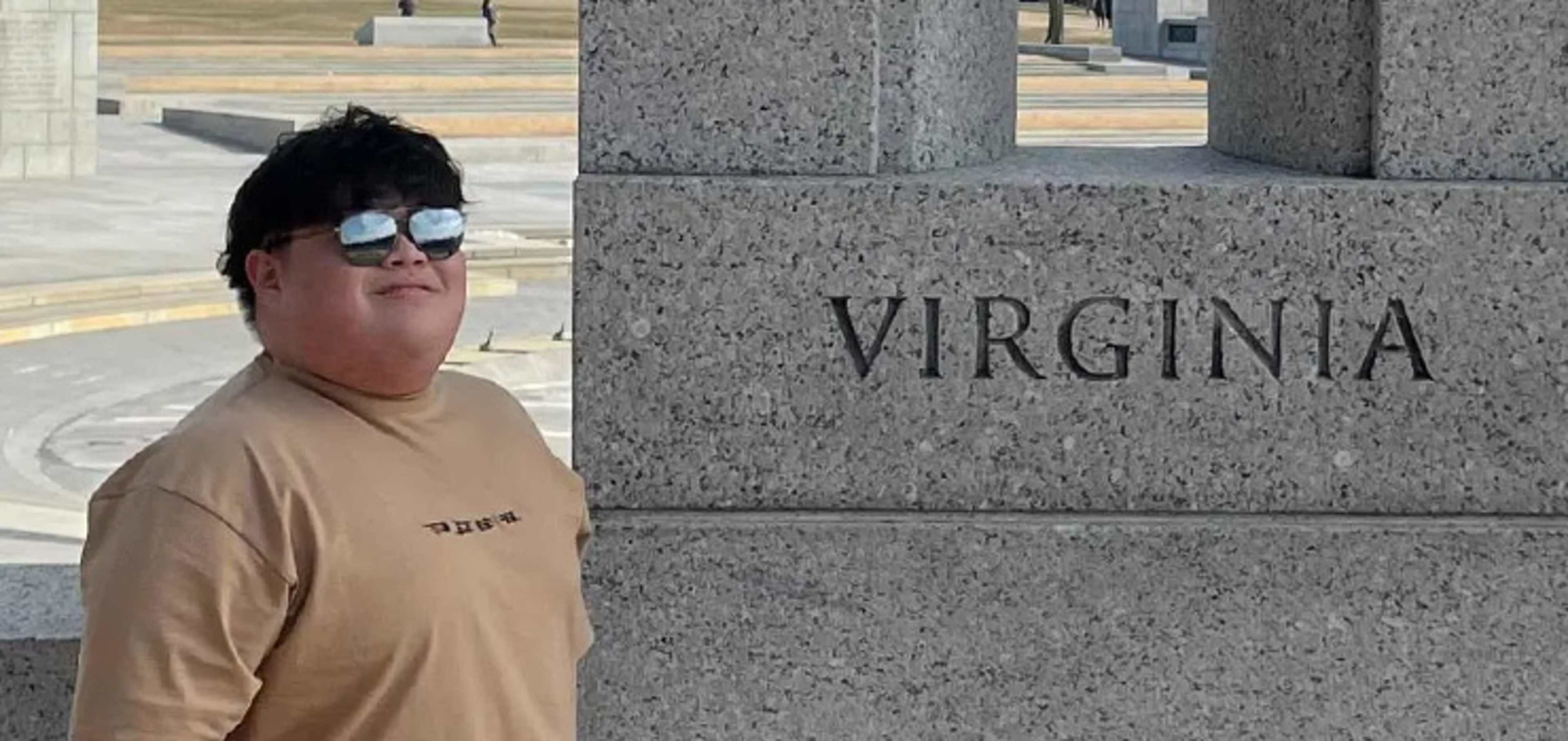 Man next to a wall that says Virginia