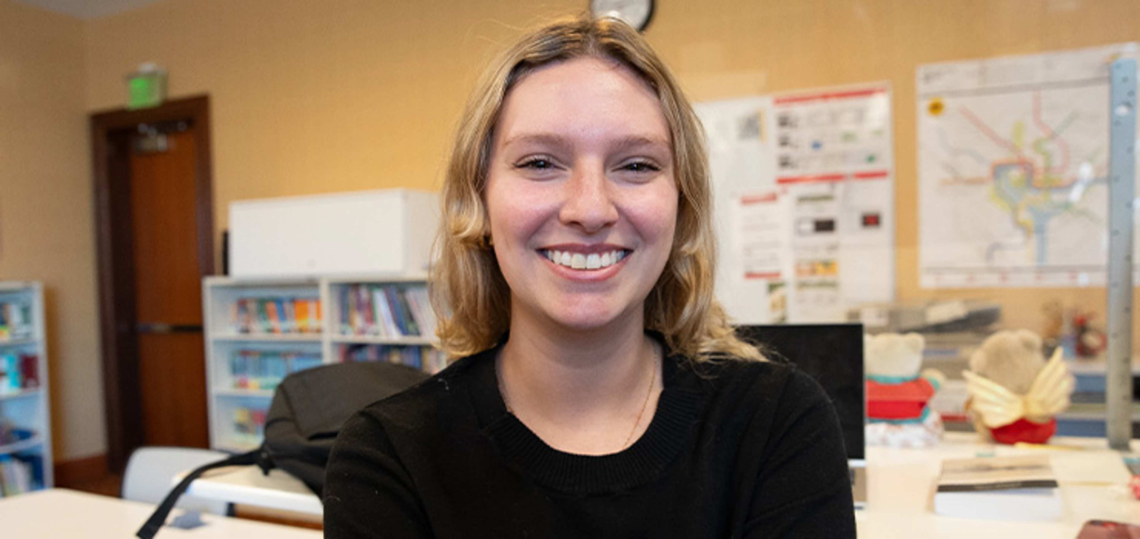 Student in front of a desk
