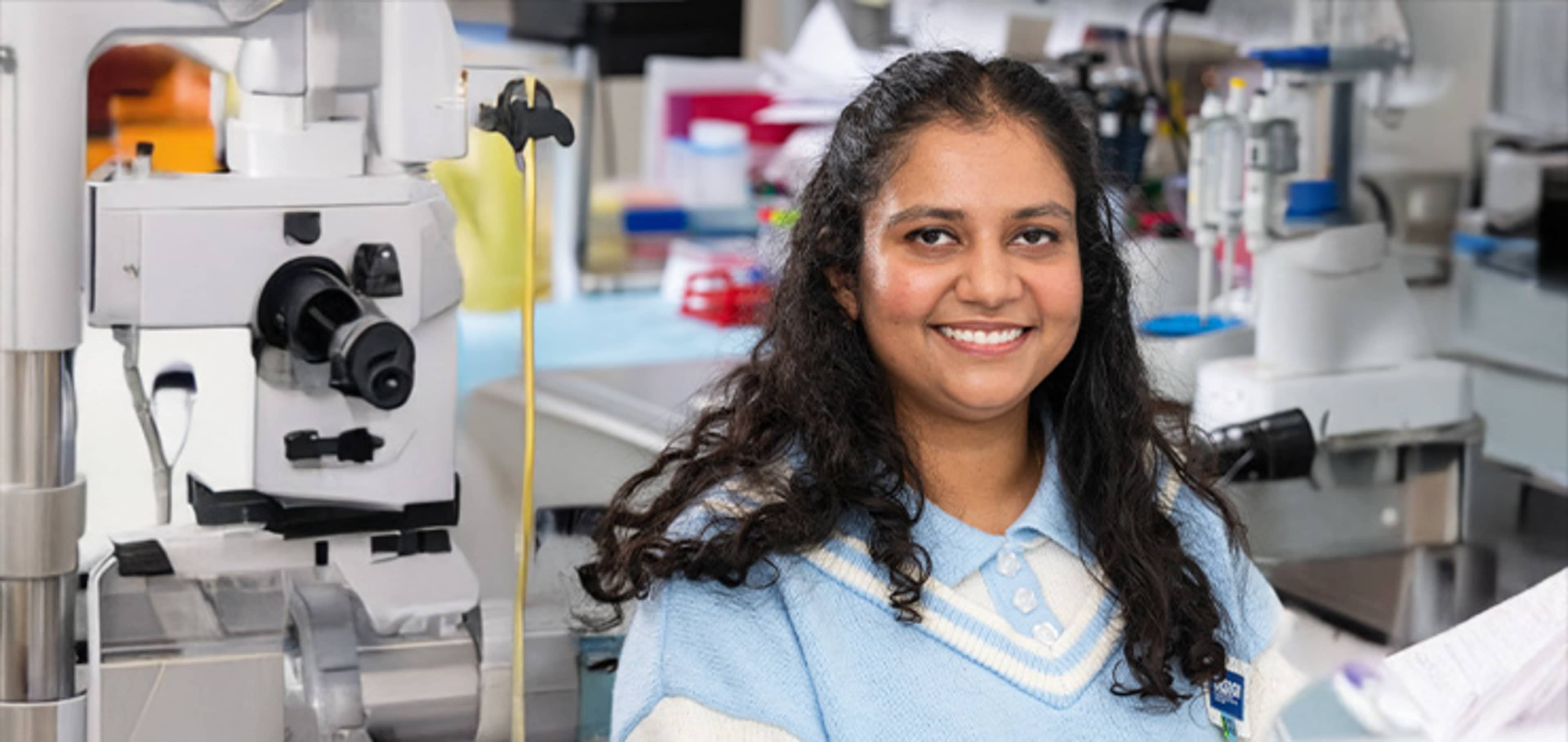 Student in front of a lab desk