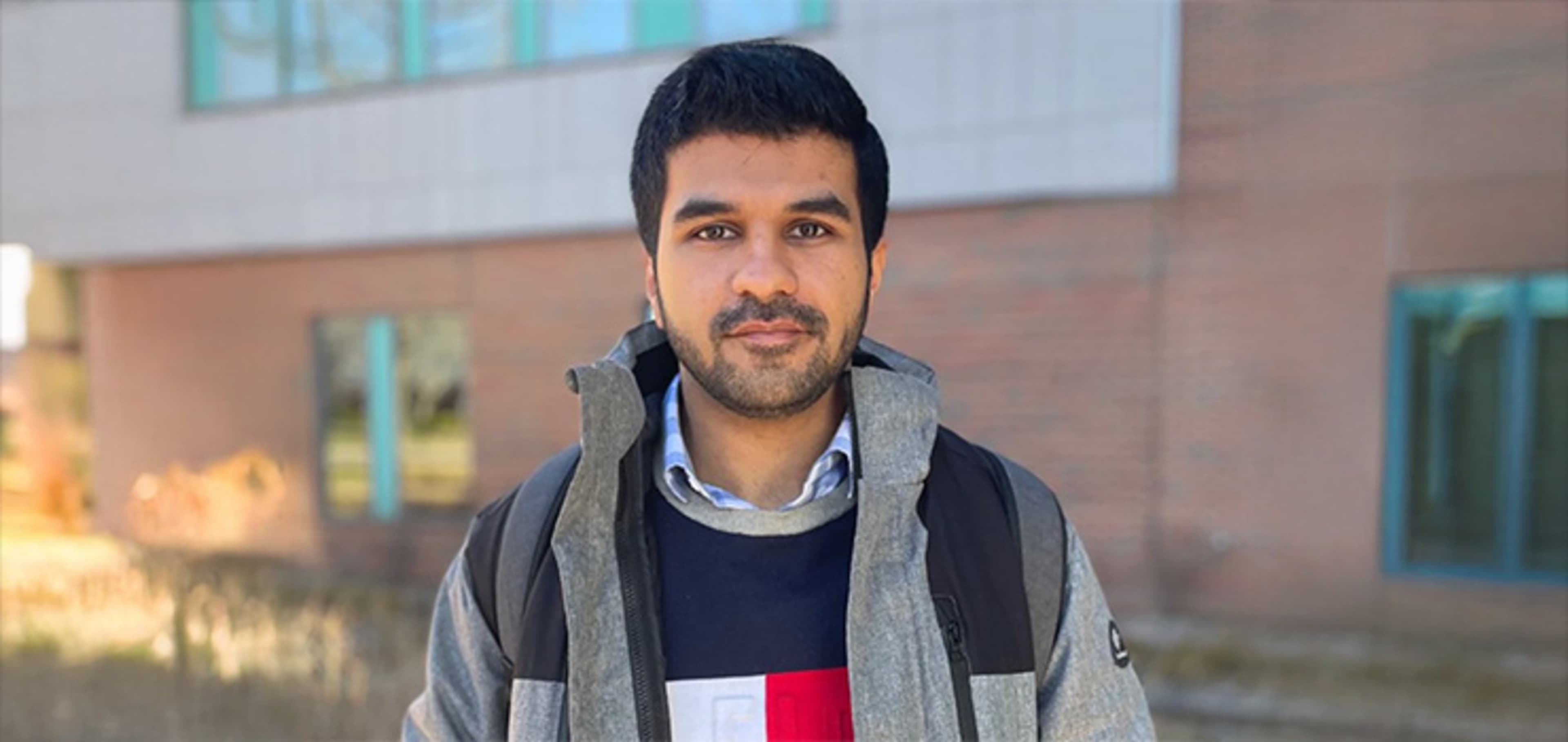 Student in front of a building
