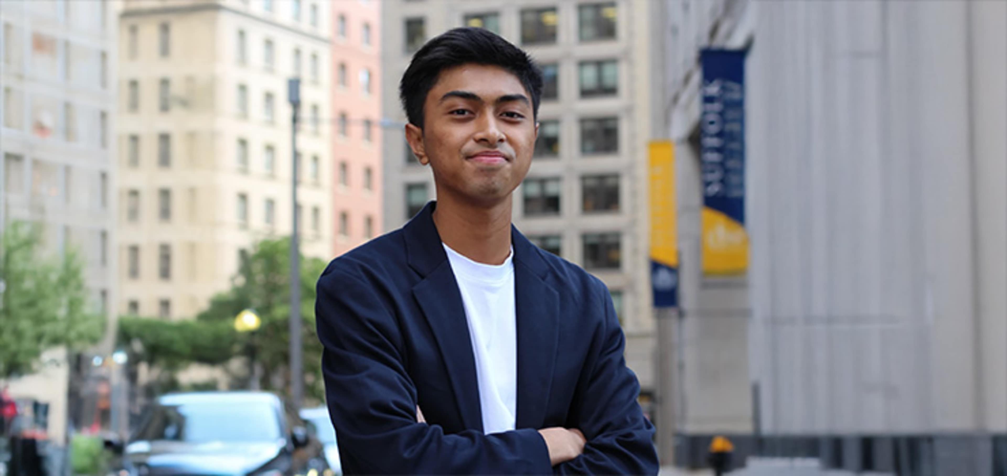 Student in front of a building