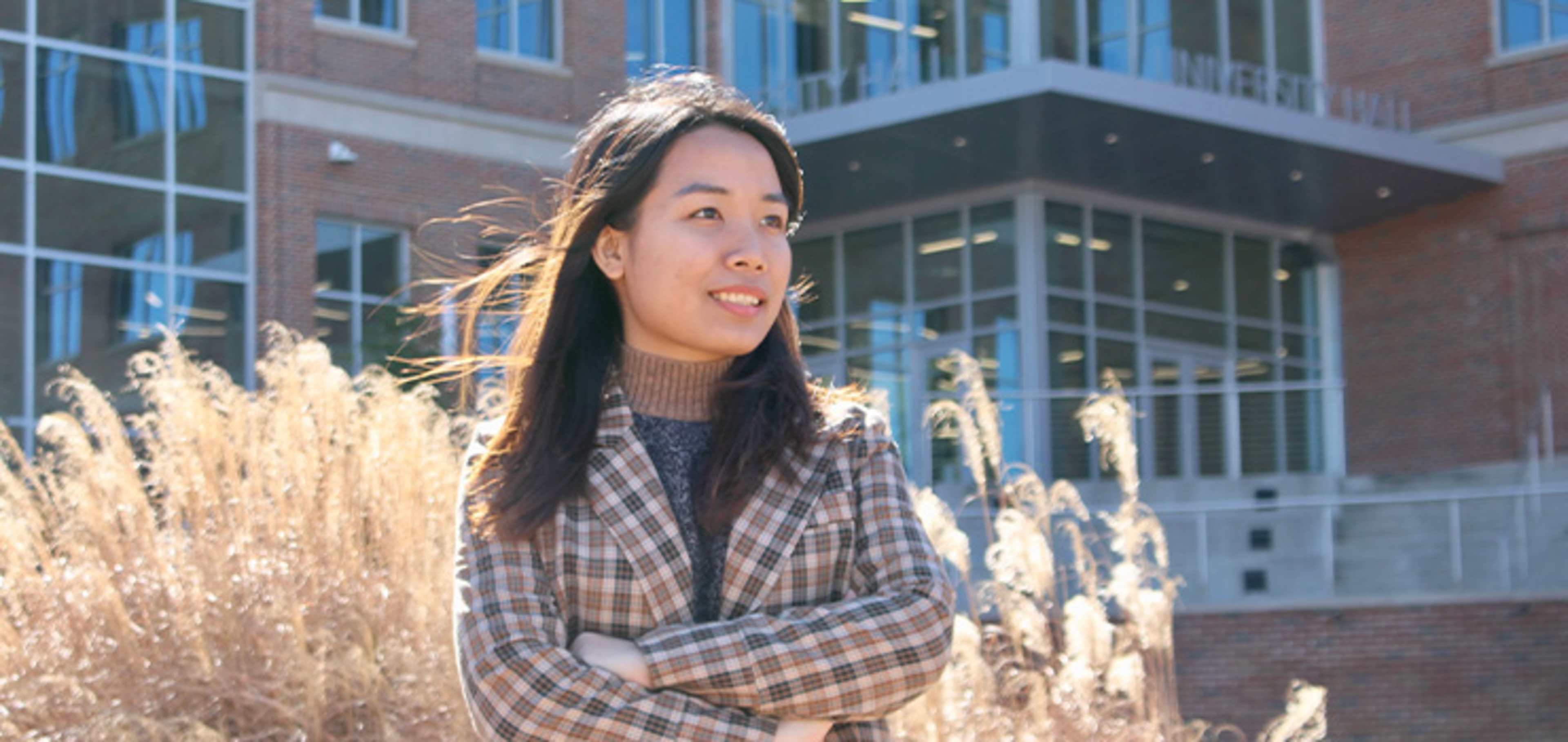 Student in front of a building