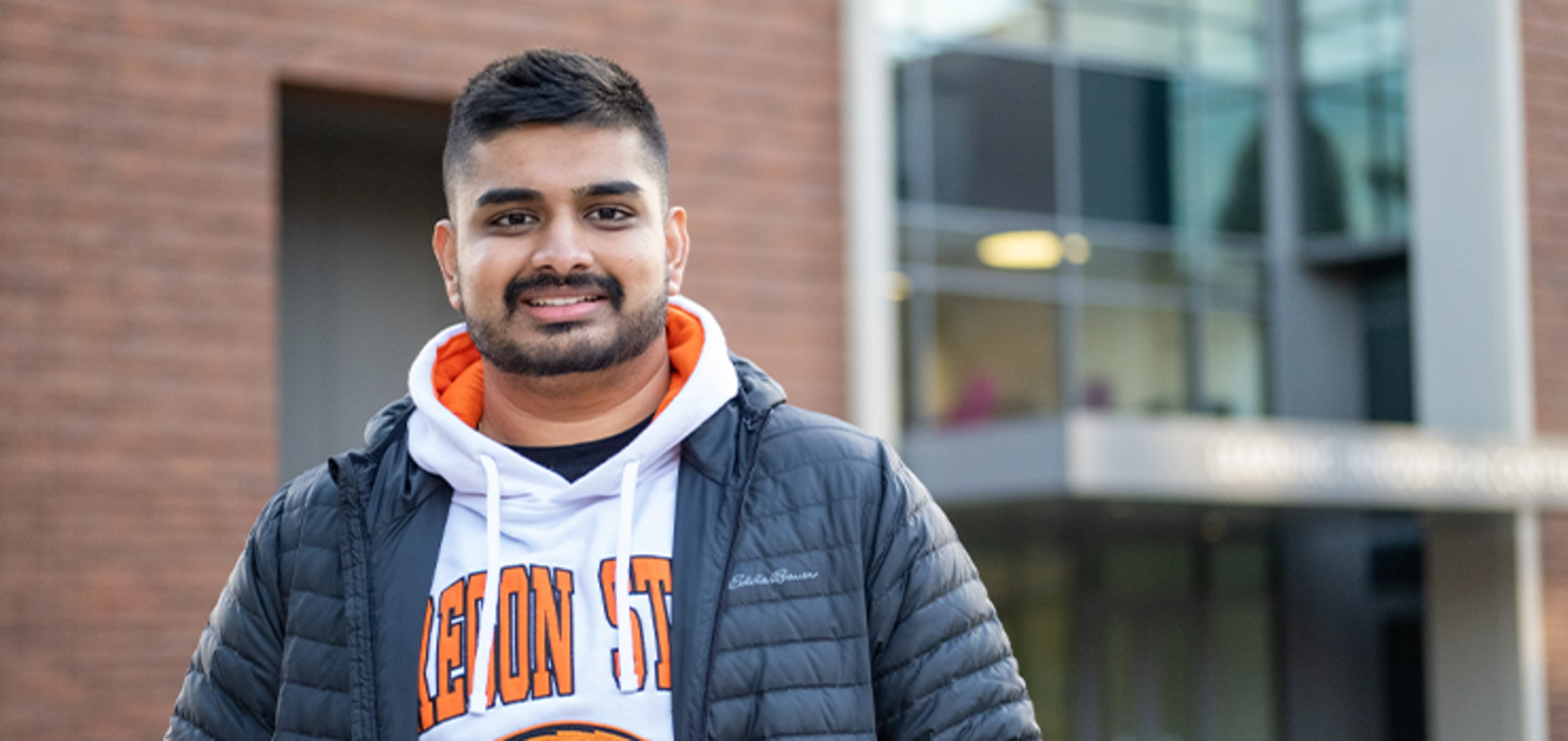 Student in front of a building