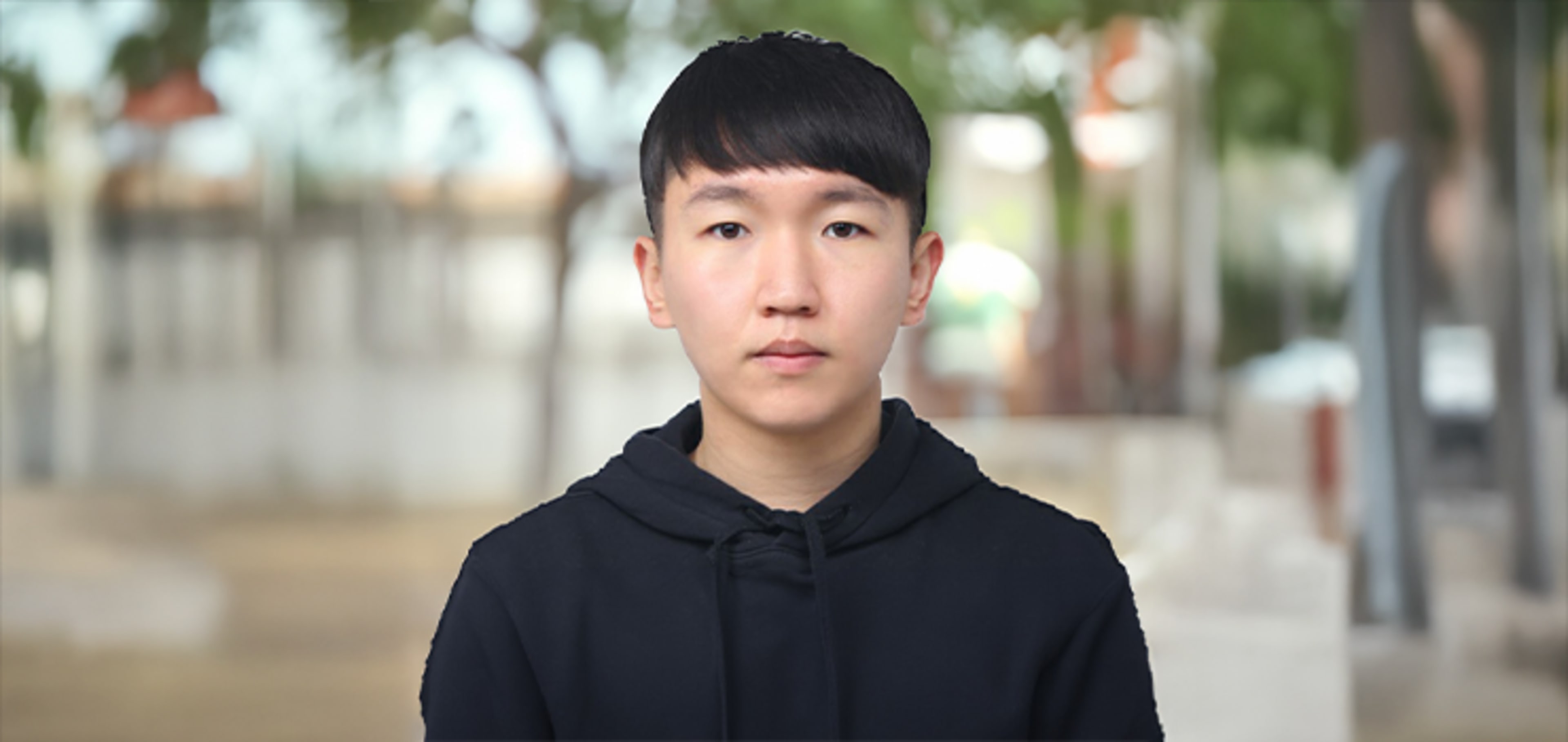 Student facing camera with blur background