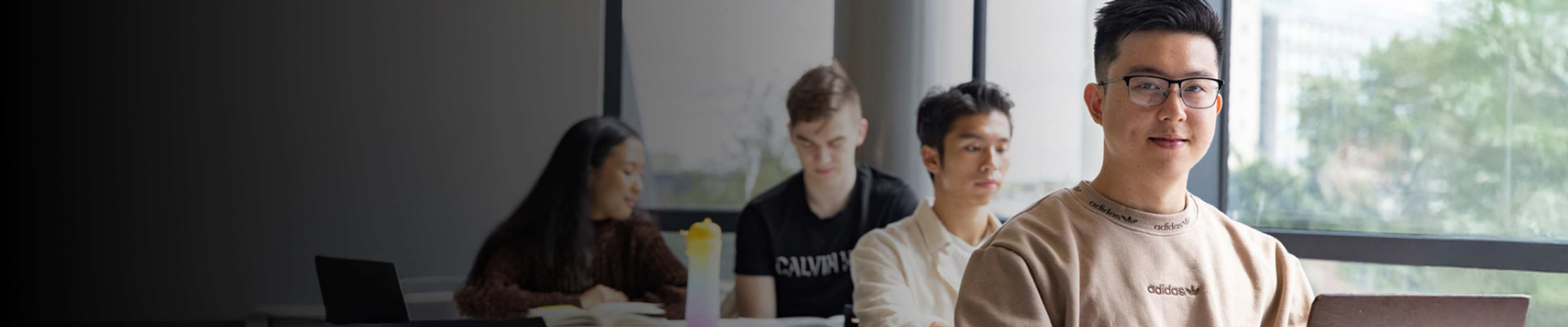 English language student in class with other students