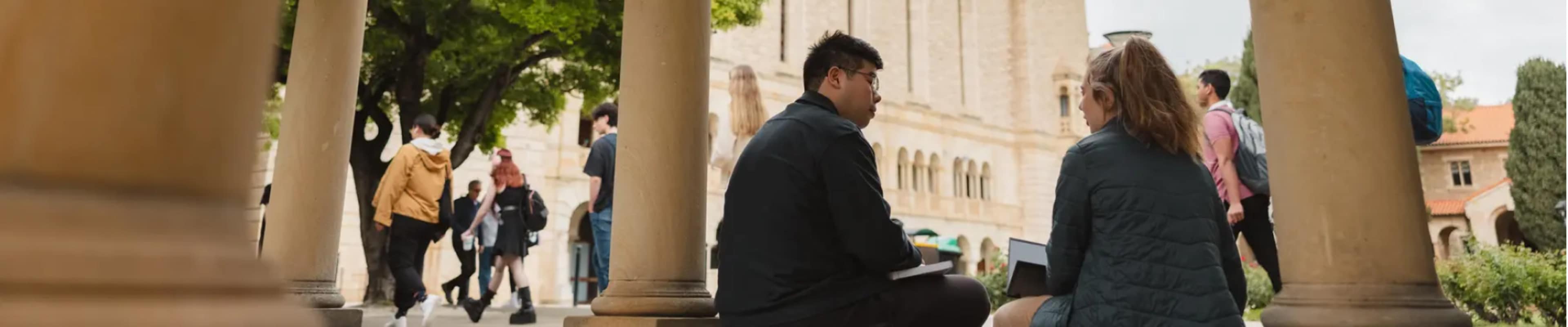 Students casually sitting in quad