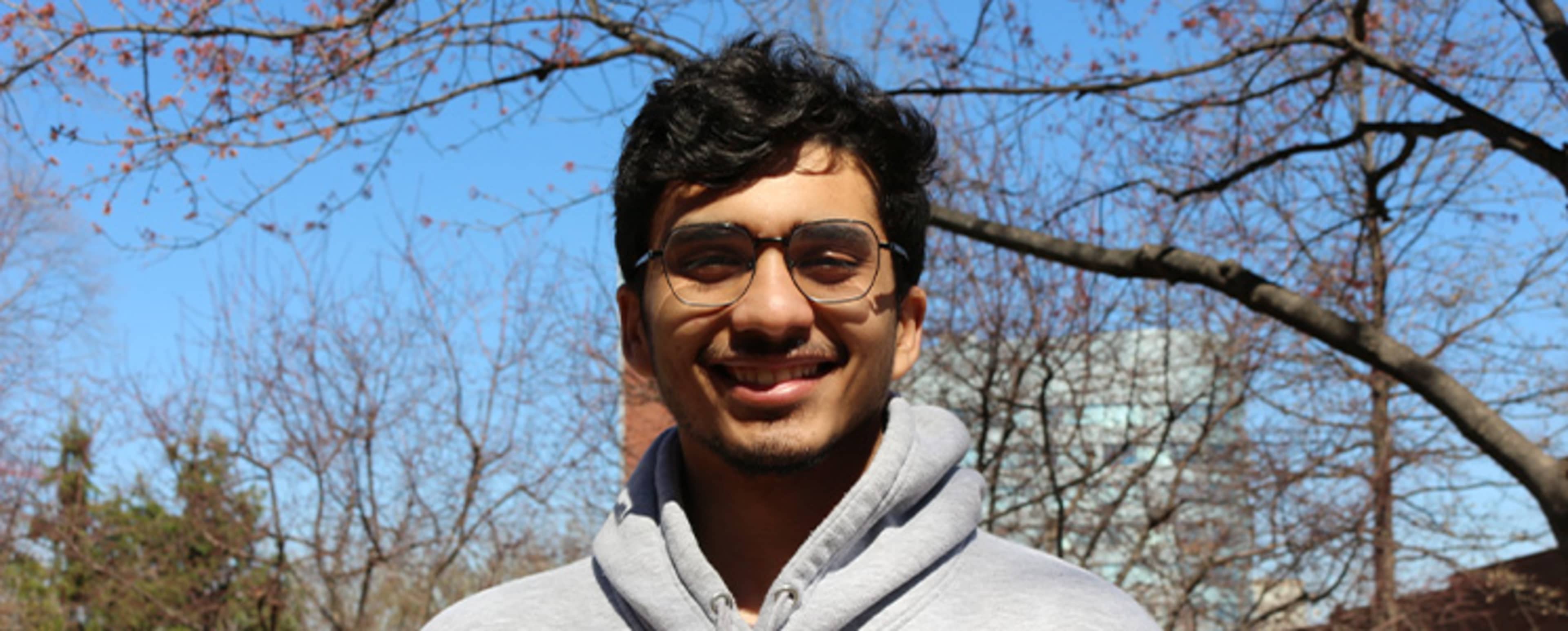 Student in front of a building