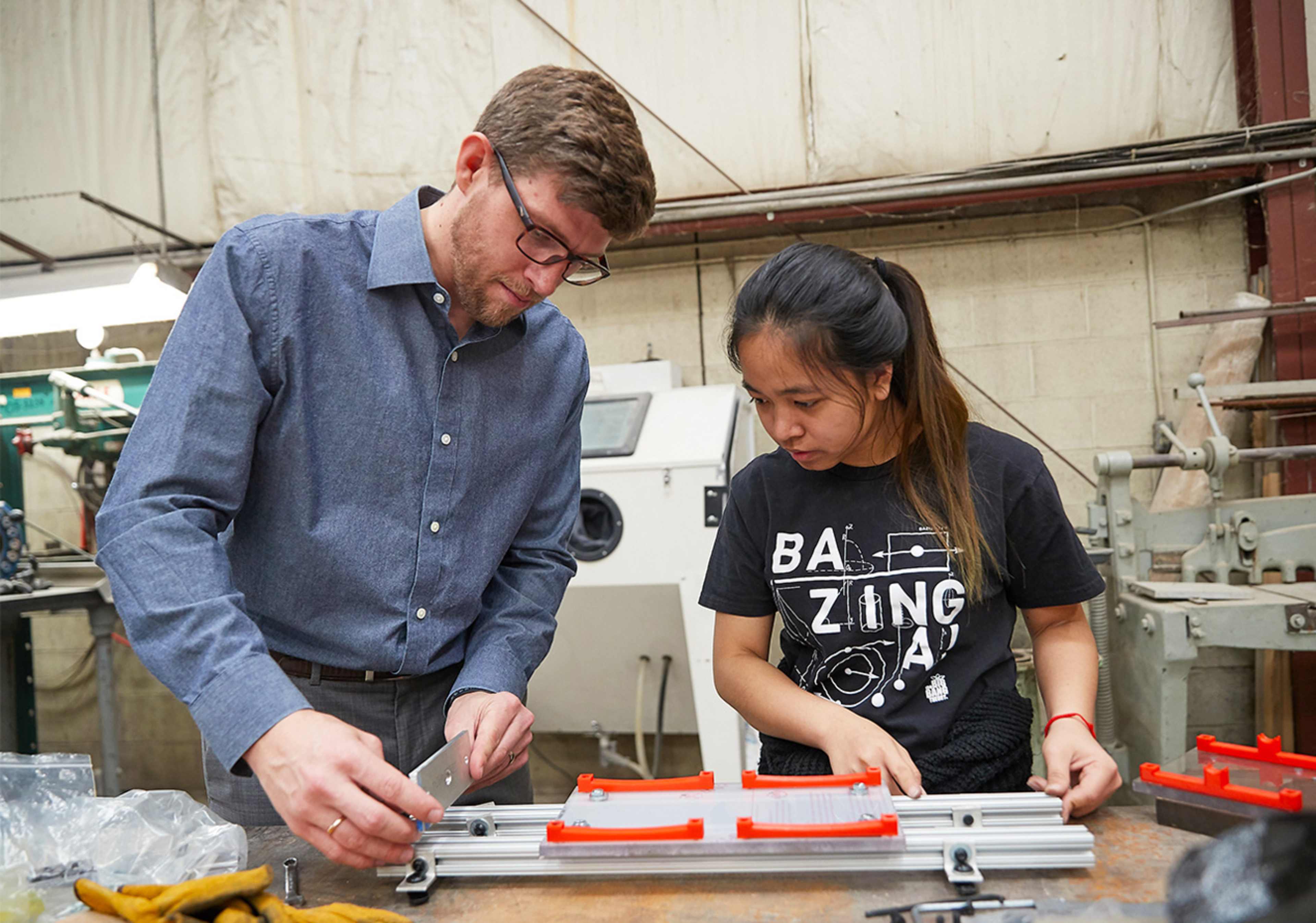 Student and teacher working on a project