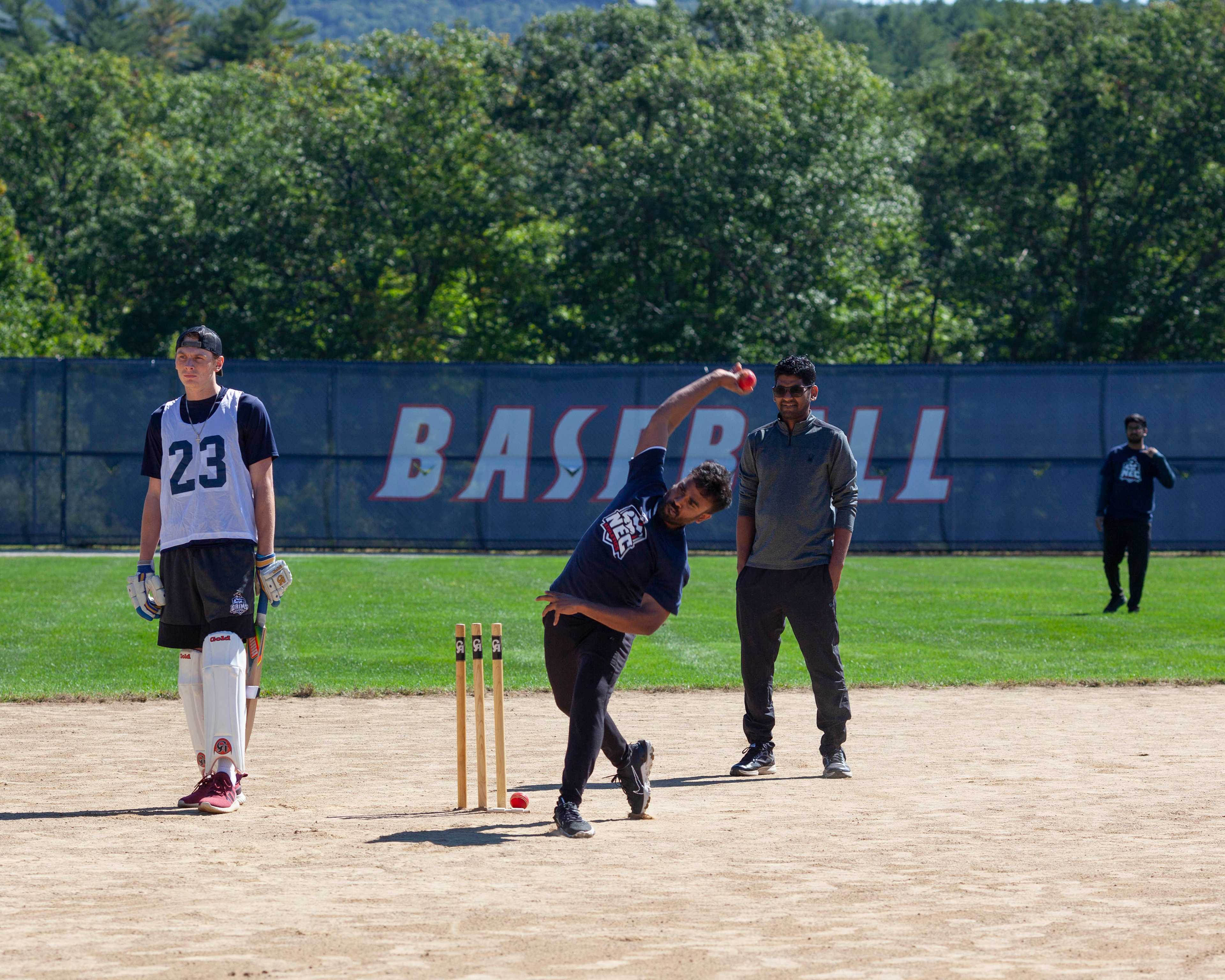 Students playing cricket