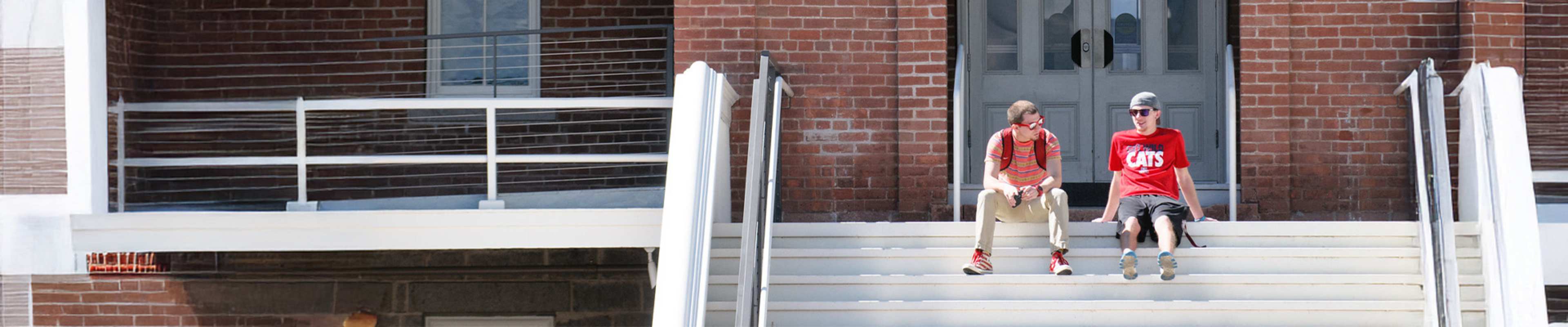 Student walking down the stairs of a library