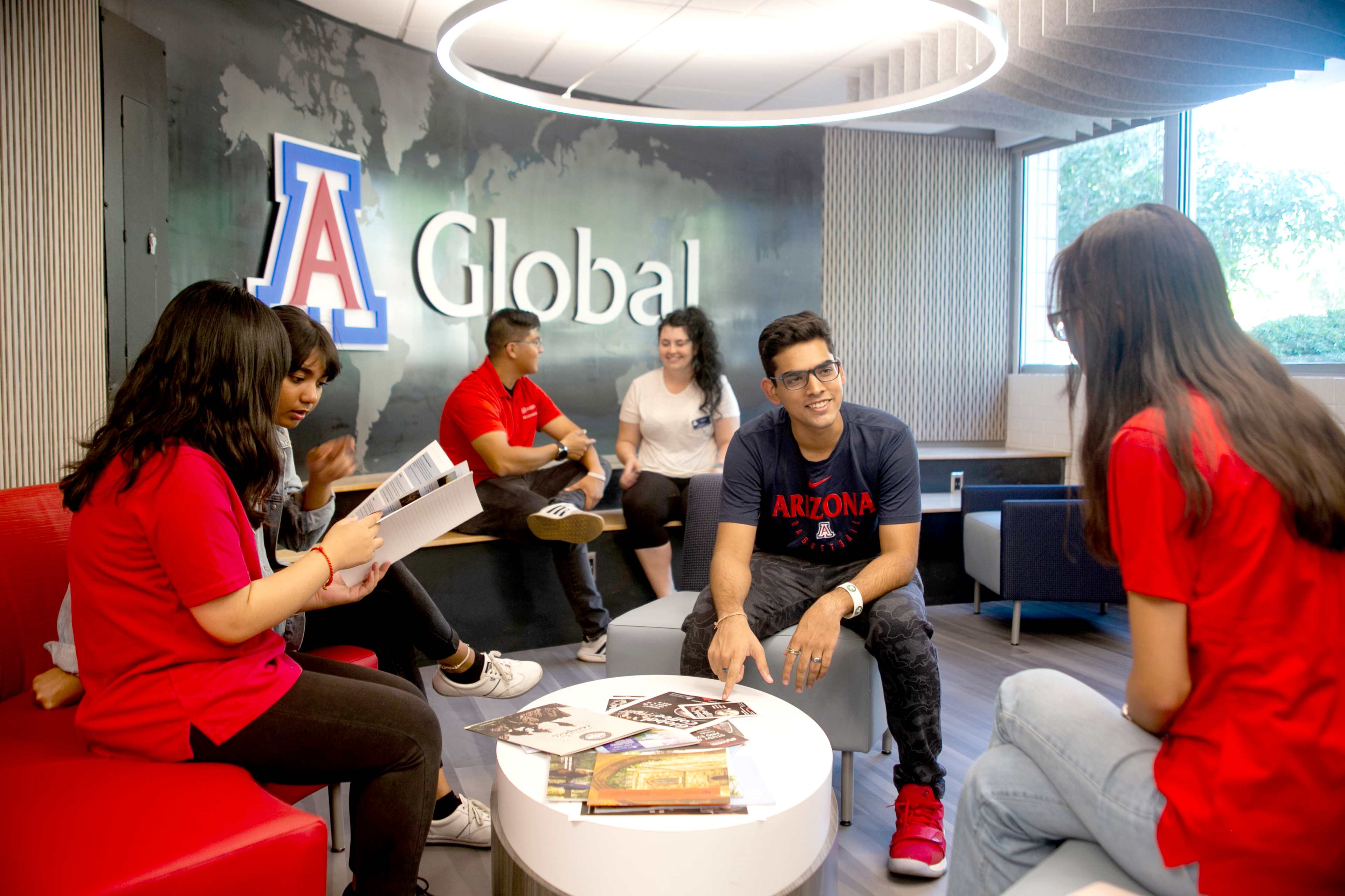 Students in a room sharing and talking