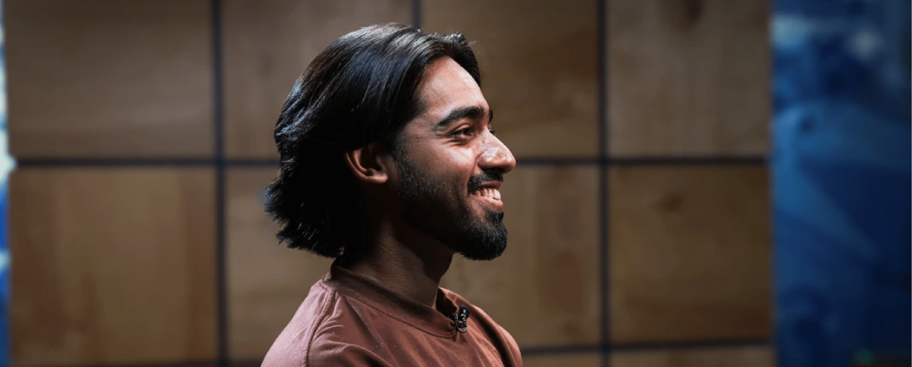Student looking at the right side while smiling