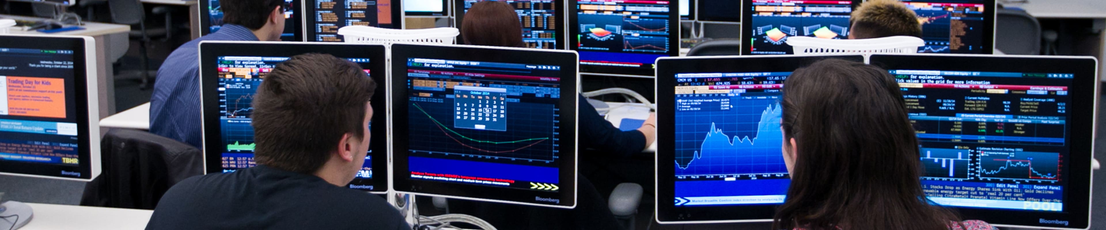 Students looking at the computer stadistics