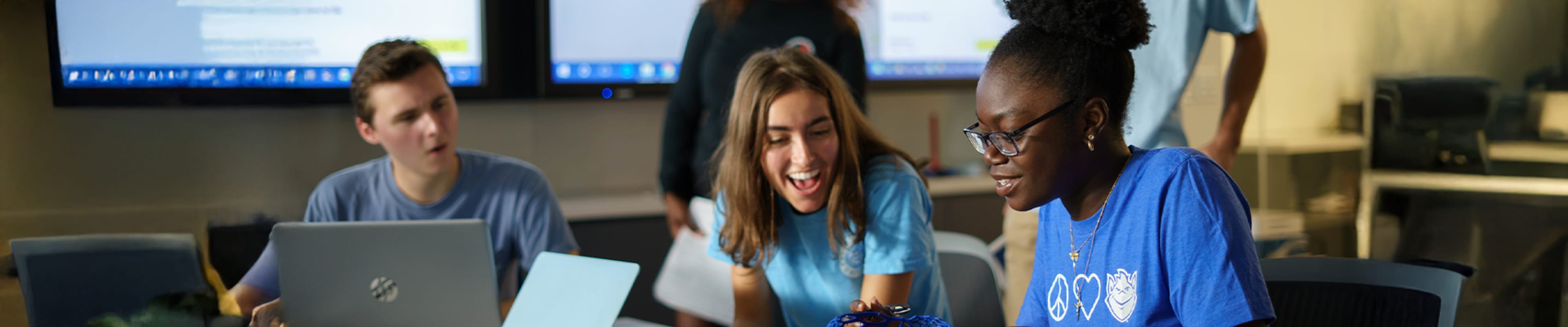 Students sharing in a clasroom desk