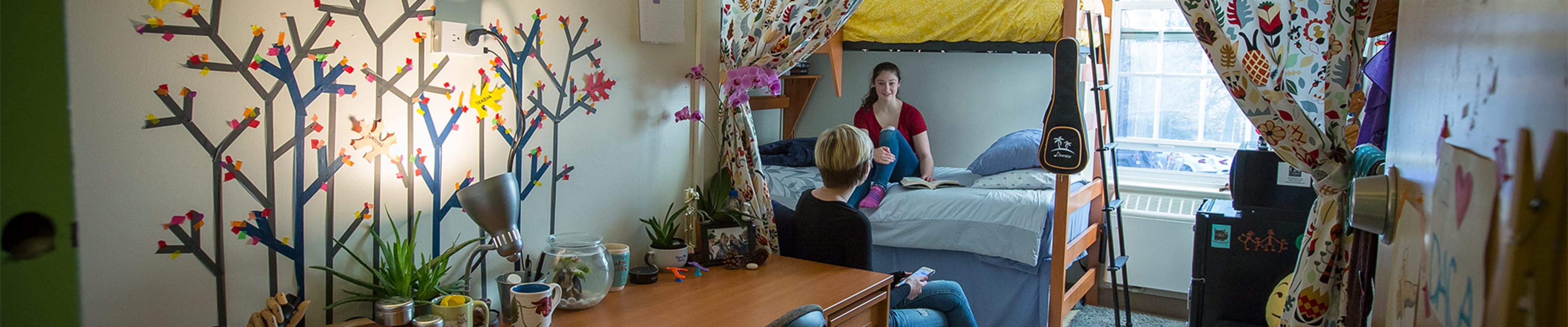 Students talking in a dorm