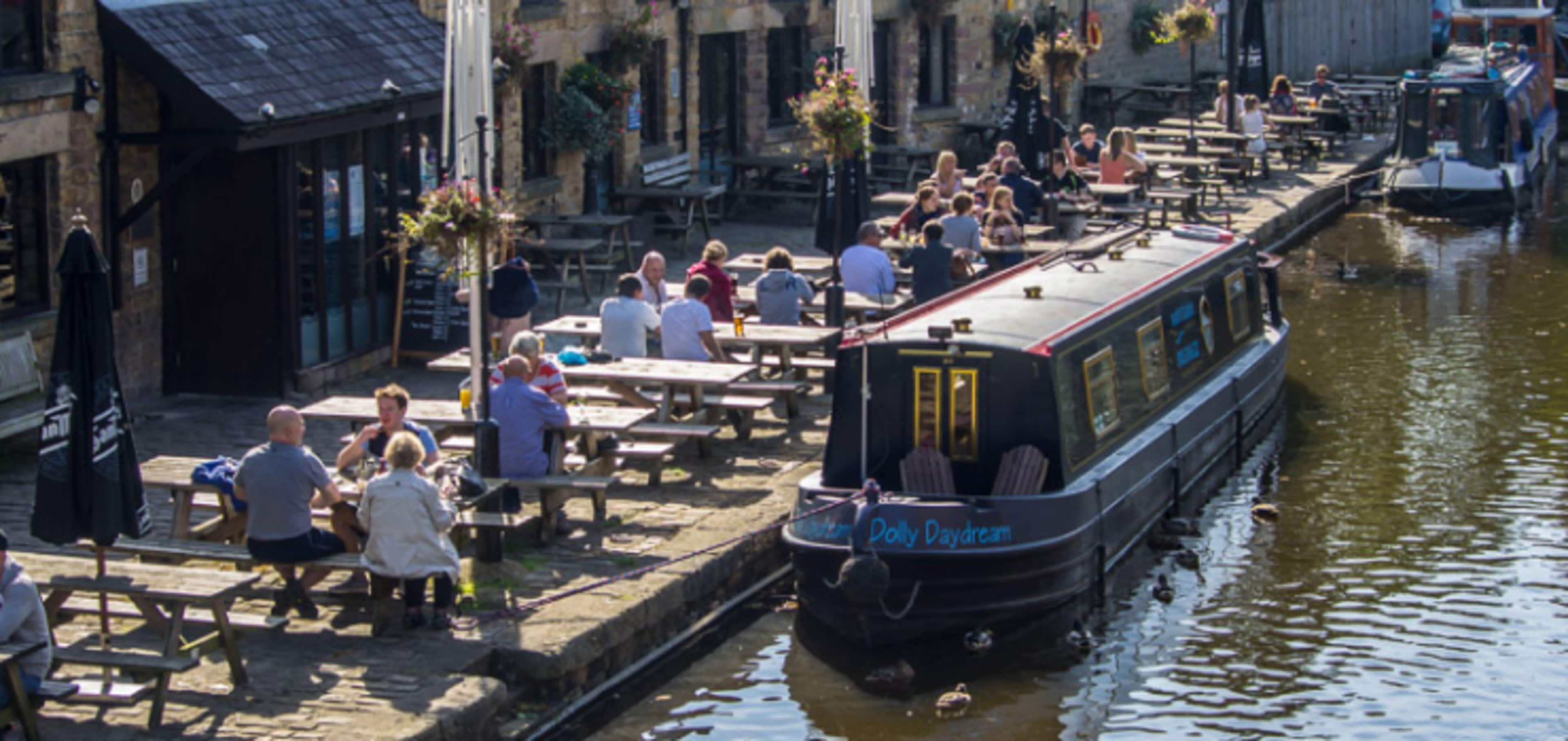 People dining at a restaurant along Lancaster Canal