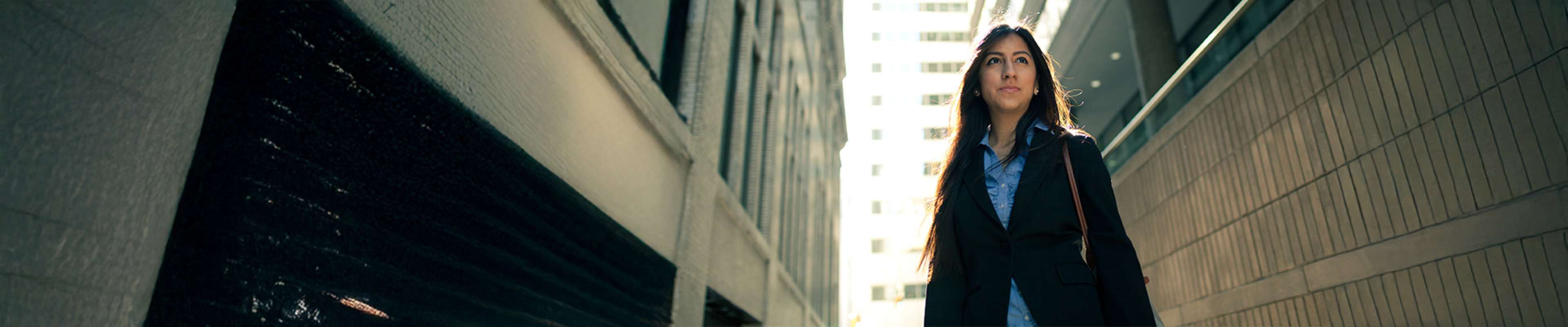 Student walking in Wall street