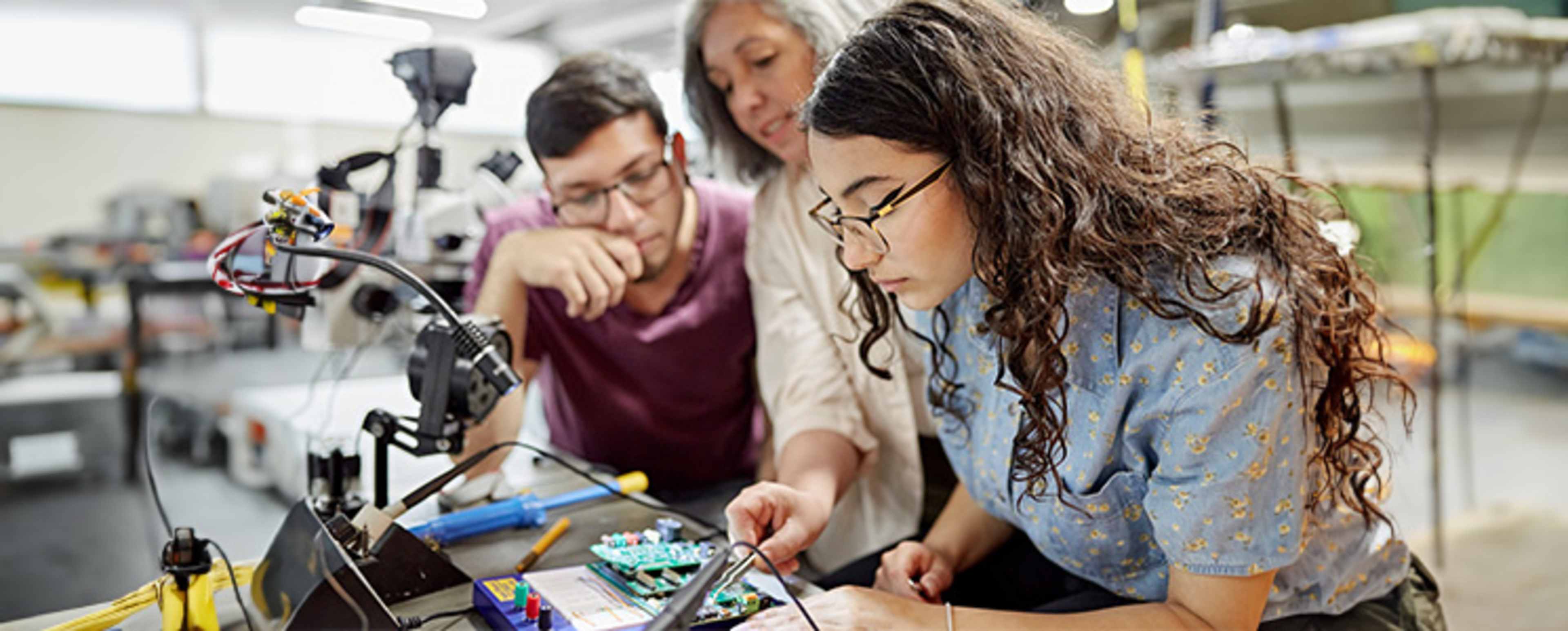 Mechanical engineering students working on a project