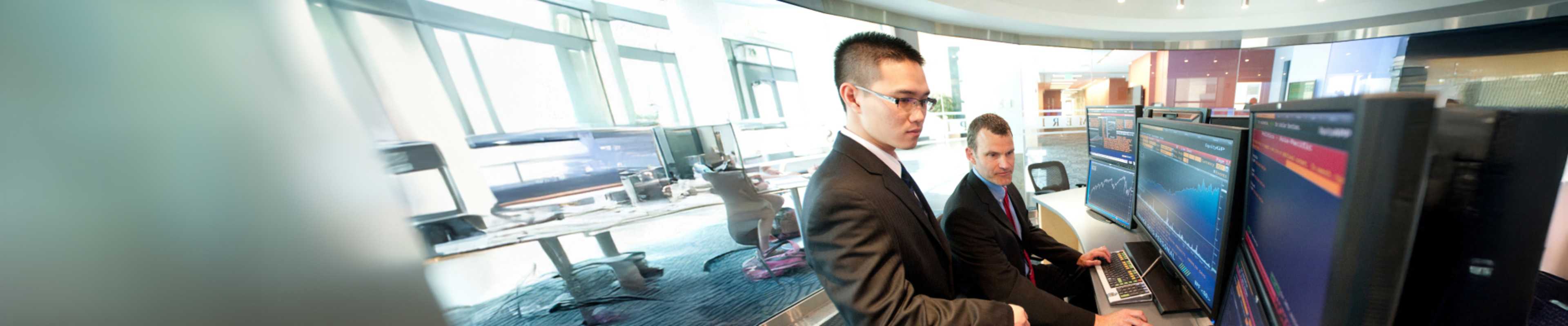 Foreign Employee being guided by his mentor at work