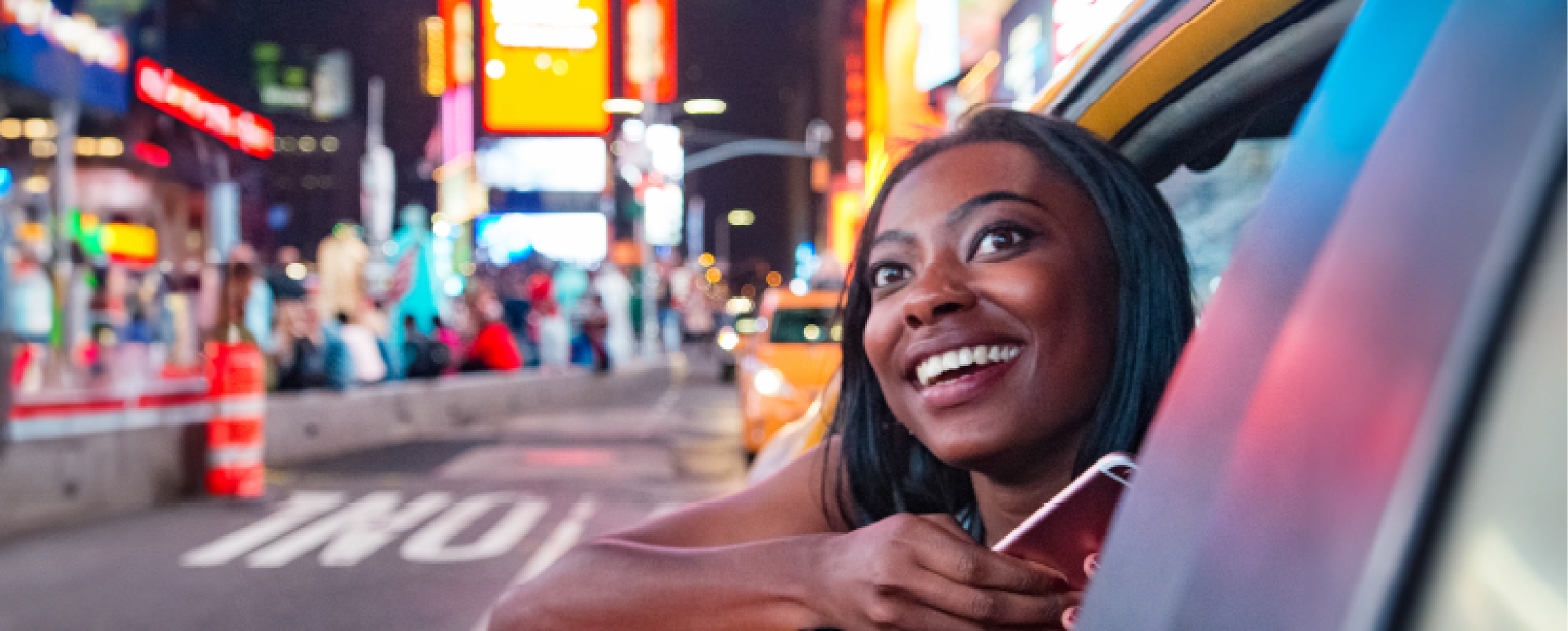 Student leaning her head of a NYC Taxi windiow