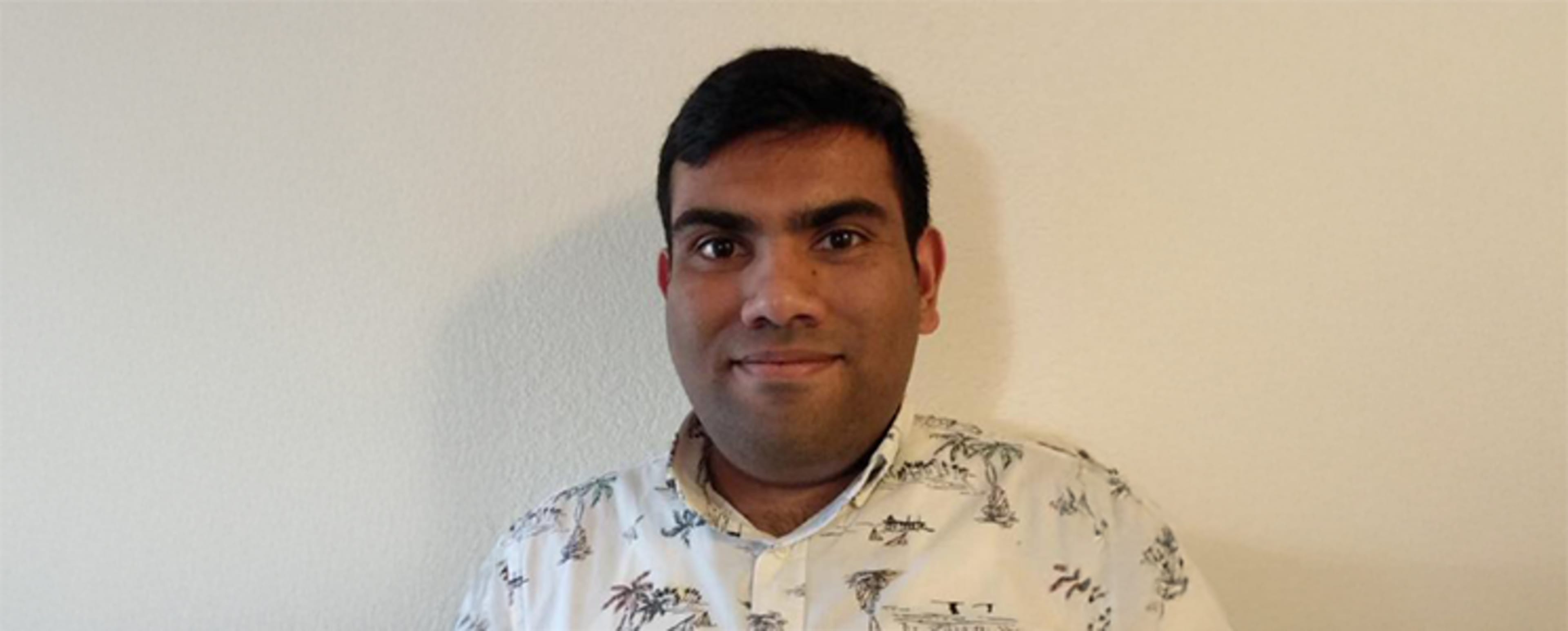 Harsh smilling at the camera