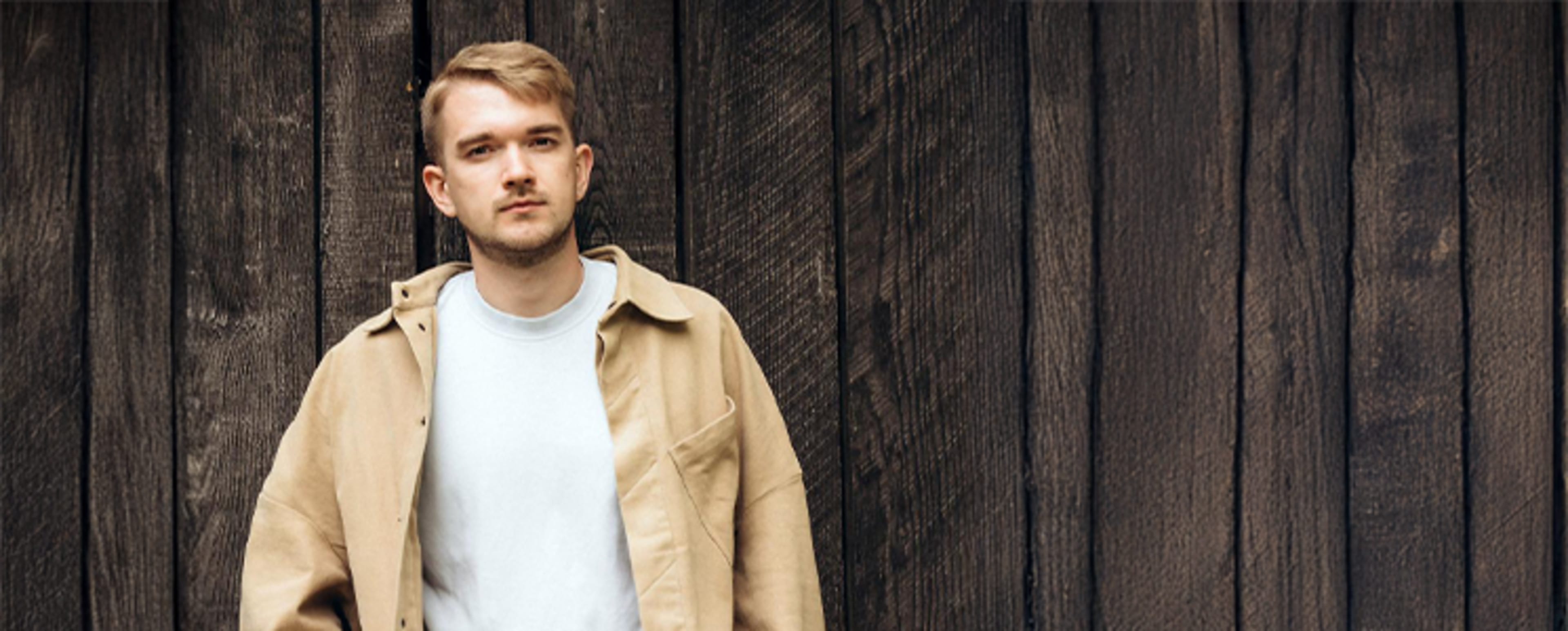 Siarhei smilling at the camera