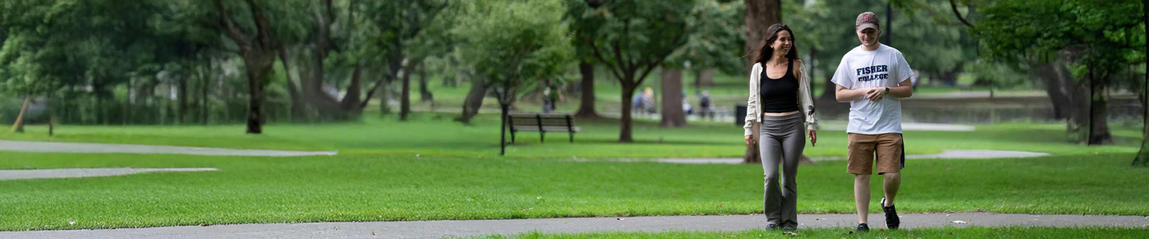 Two international students hanging out in a park