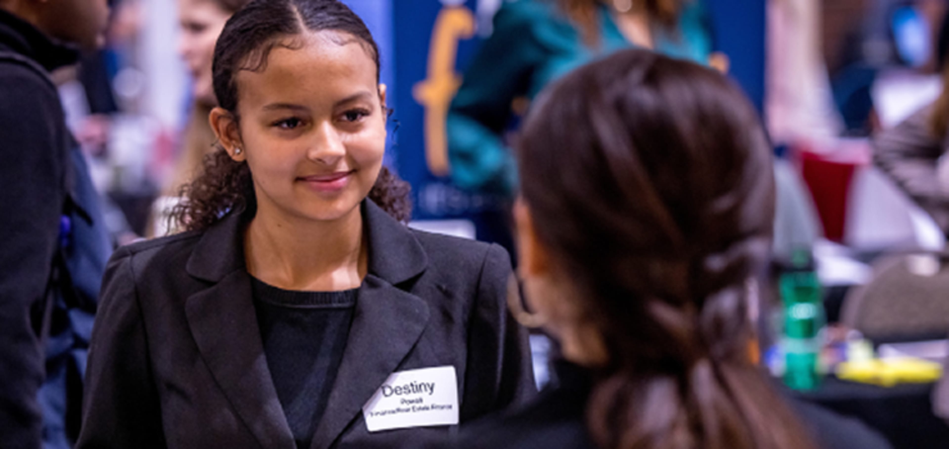 Student walking around with classmate