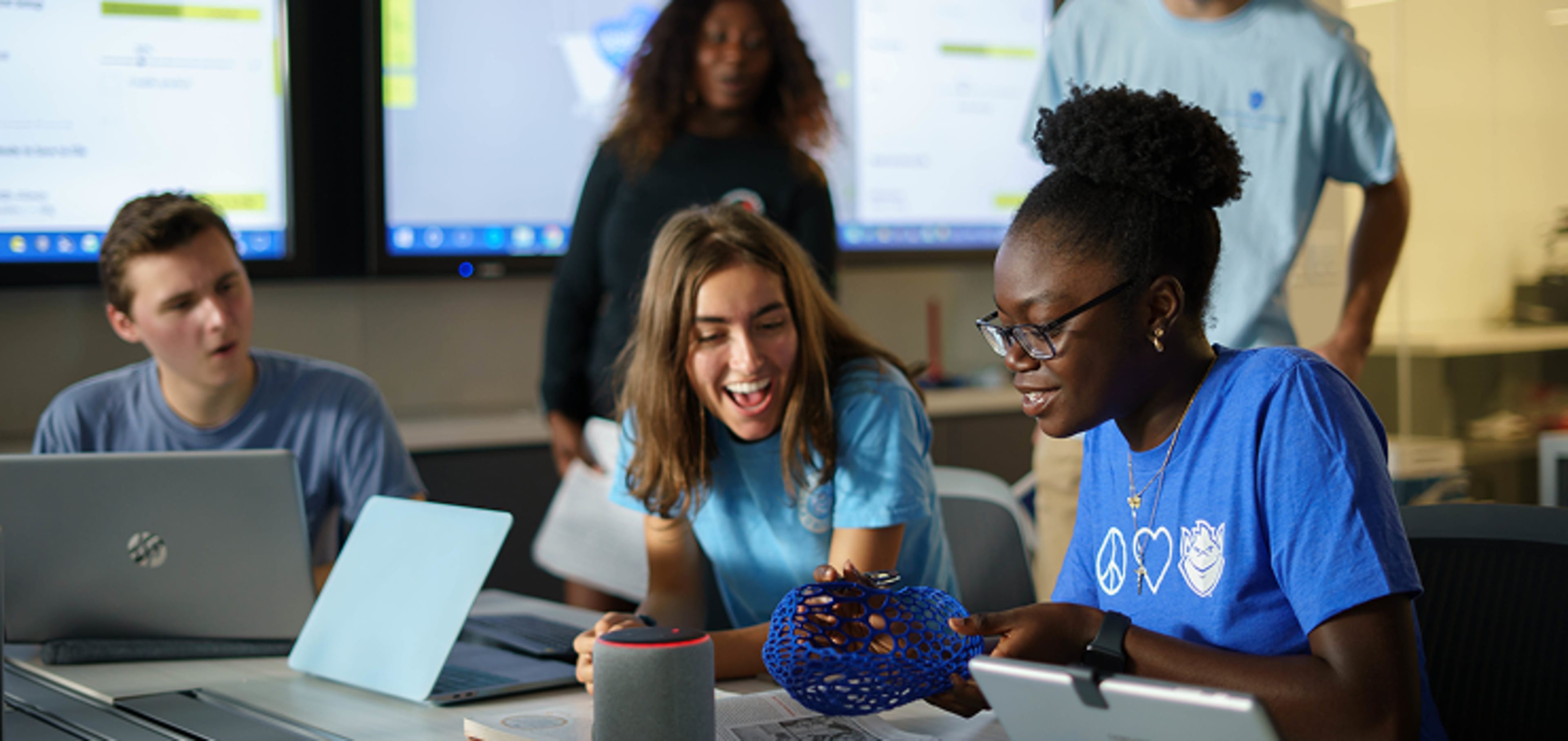 A group of students working on their laptops