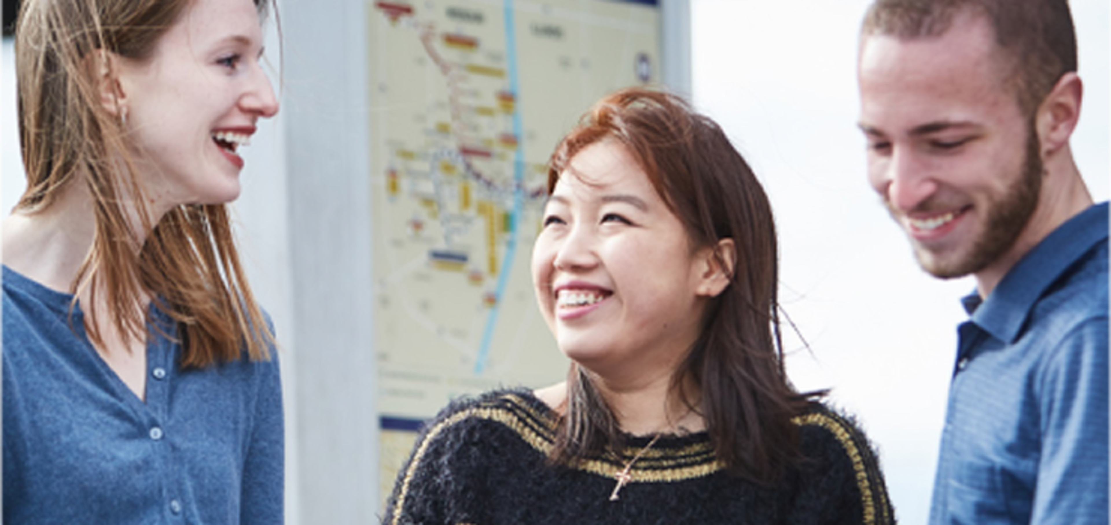 Student having a conversation while simlling